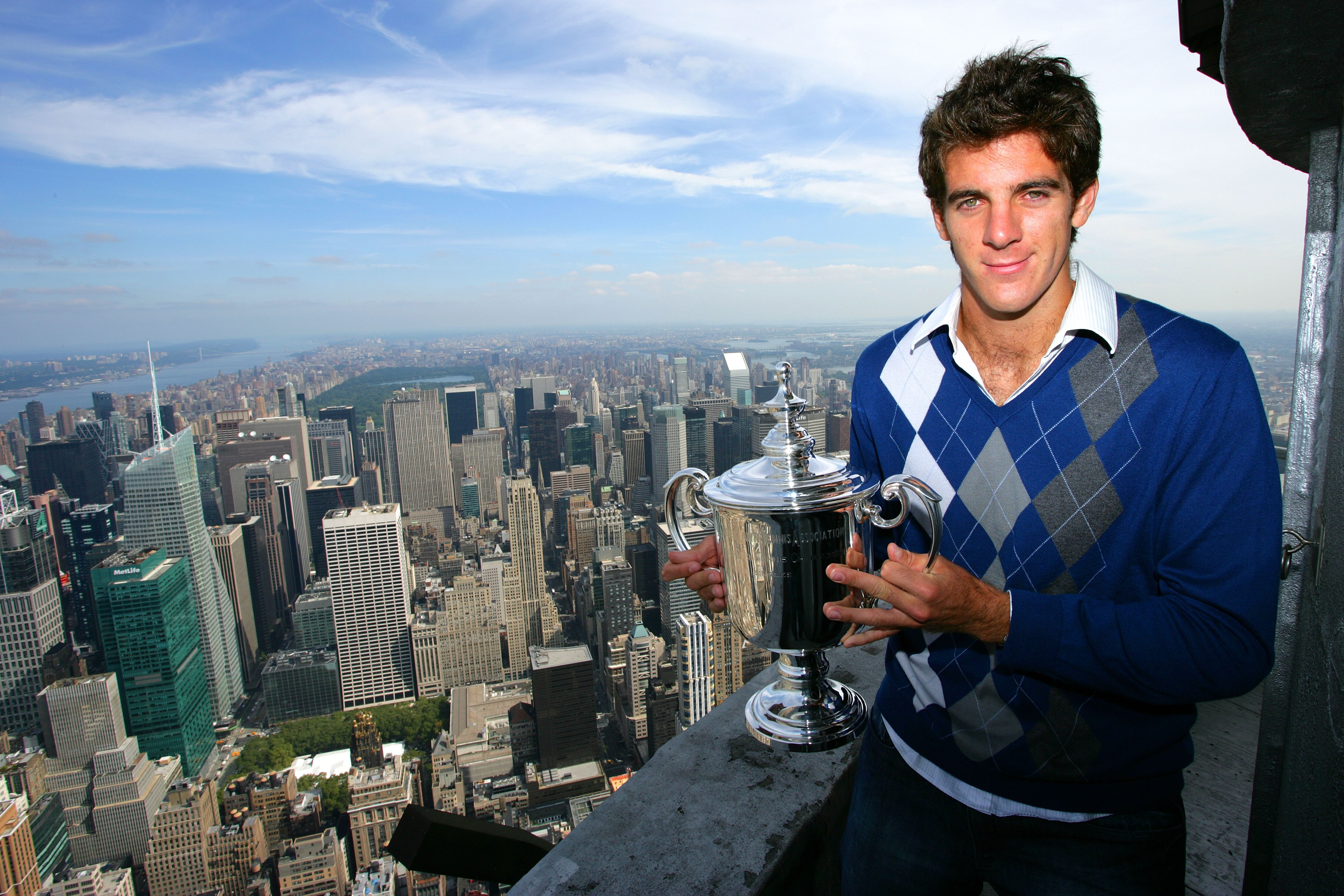 NEW YORK - SEPTEMBER 15: Juan Martin Del Potro the 2009 US Open Tennis Champion poses with the US Open trophy on a viewing deck at the Empire State Building on September 15, 2009 in New York City.  (Photo by Chris Trotman/Getty Images for ATP Tour)