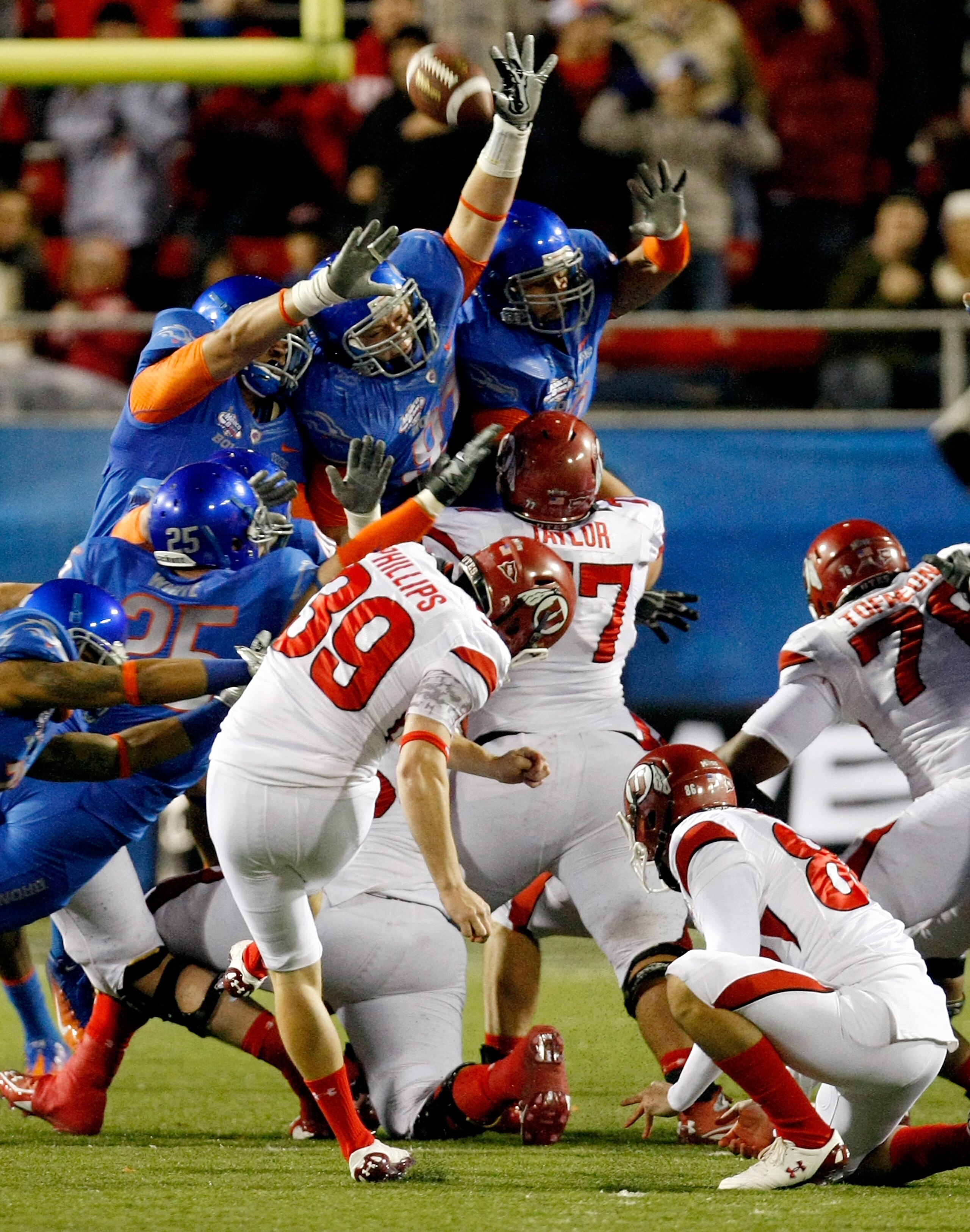 LAS VEGAS, NV - DECEMBER 22:  Members of the Boise State Broncos try to block a field goal by kicker Joe Phillips #39 of the Utah Utes during the MAACO Bowl Las Vegas at Sam Boyd Stadium December 22, 2010 in Las Vegas, Nevada. Boise State Won 26-3.  (Phot