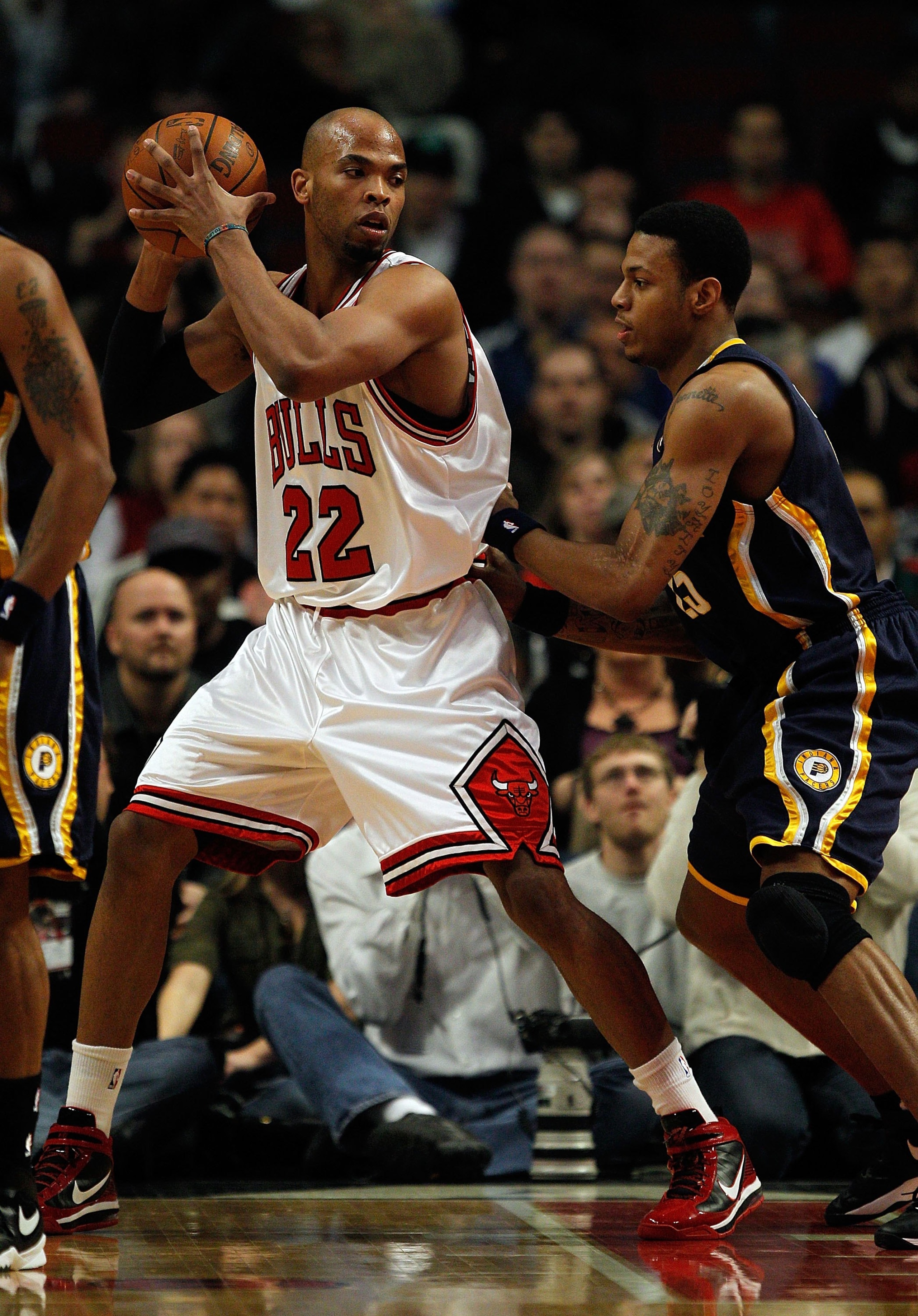 CHICAGO - FEBRUARY 24: Taj Gibson #22 of the Chicago Bulls looks to move against Brandon Rush #25 of the Indiana Pacers at the United Center on February 24, 2010 in Chicago, Illinois. The Bulls defeated the Pacers 120-110. NOTE TO USER: User expressly ack