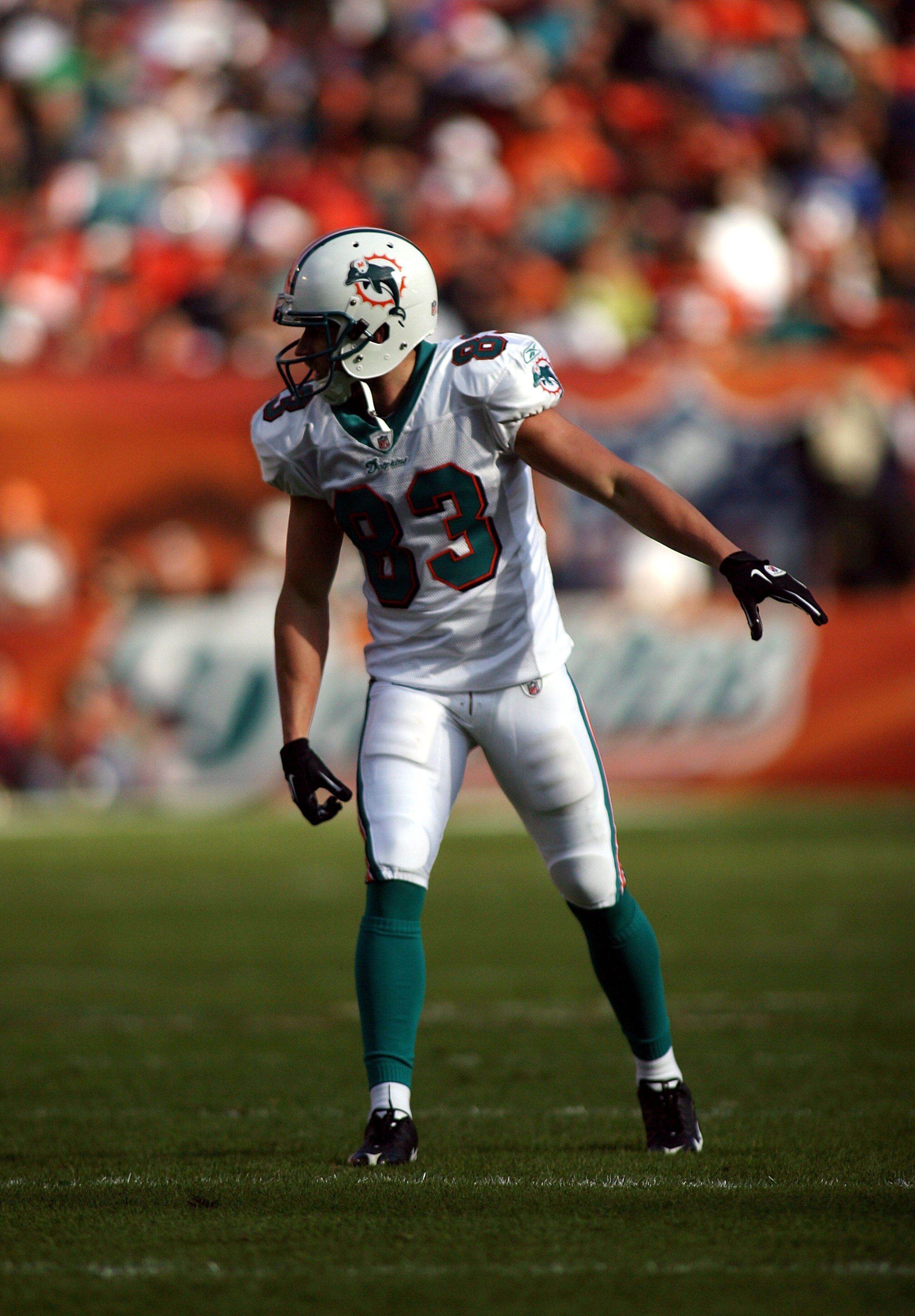 MIAMI - DECEMBER 19:  Receiver Kevin Curtis #83 of the Miami Dolphins runs against the Buffalo Bills at Sun Life Stadium on December 19, 2010 in Miami, Florida. The Bills defeated the Dolphins 17-14.  (Photo by Marc Serota/Getty Images)