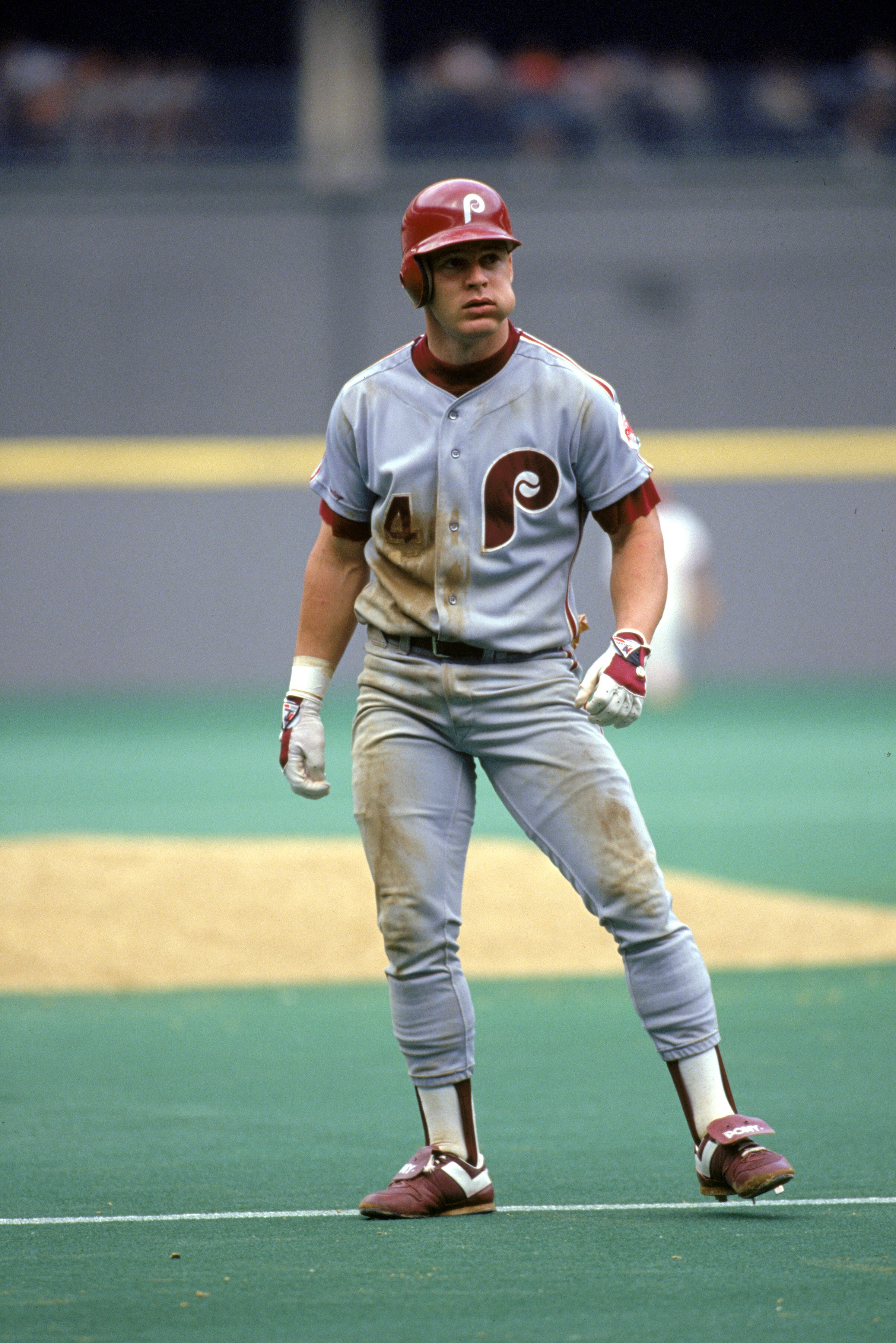 1990 - Lenny Dykstra #4 of the Philadelphia Phillies leads off base during a game in the 1990 season.  (Photo by: Rick Stewart/Getty Images )