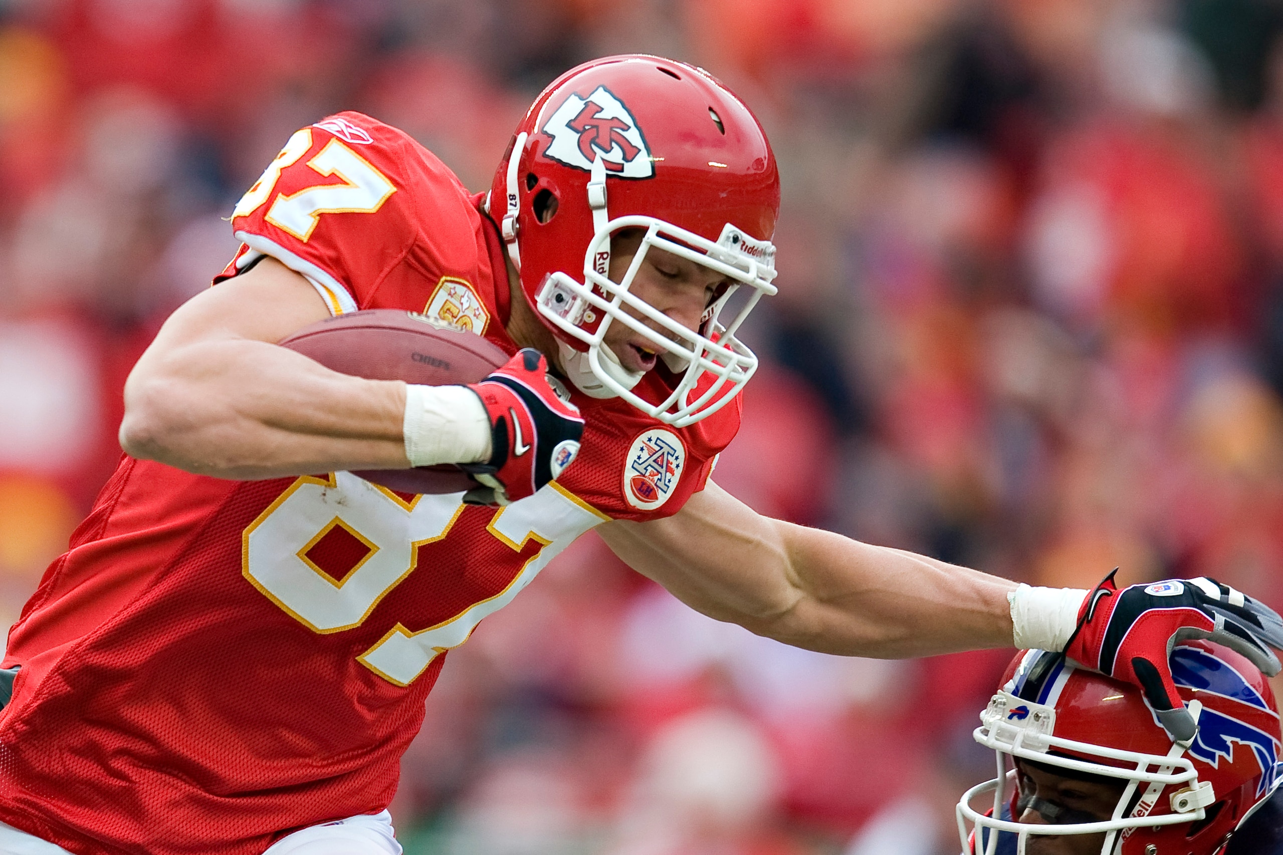 KANSAS CITY, MO - DECEMBER 13: Tight end Brad Cottam #87 of the Kansas City Chiefs stiff arms a defender during a NFL game action against the Buffalo Bills at Arrowhead Stadium on December 13, 2009 in Kansas City, Missouri.  (Photo by Wesley Hitt/Getty Im