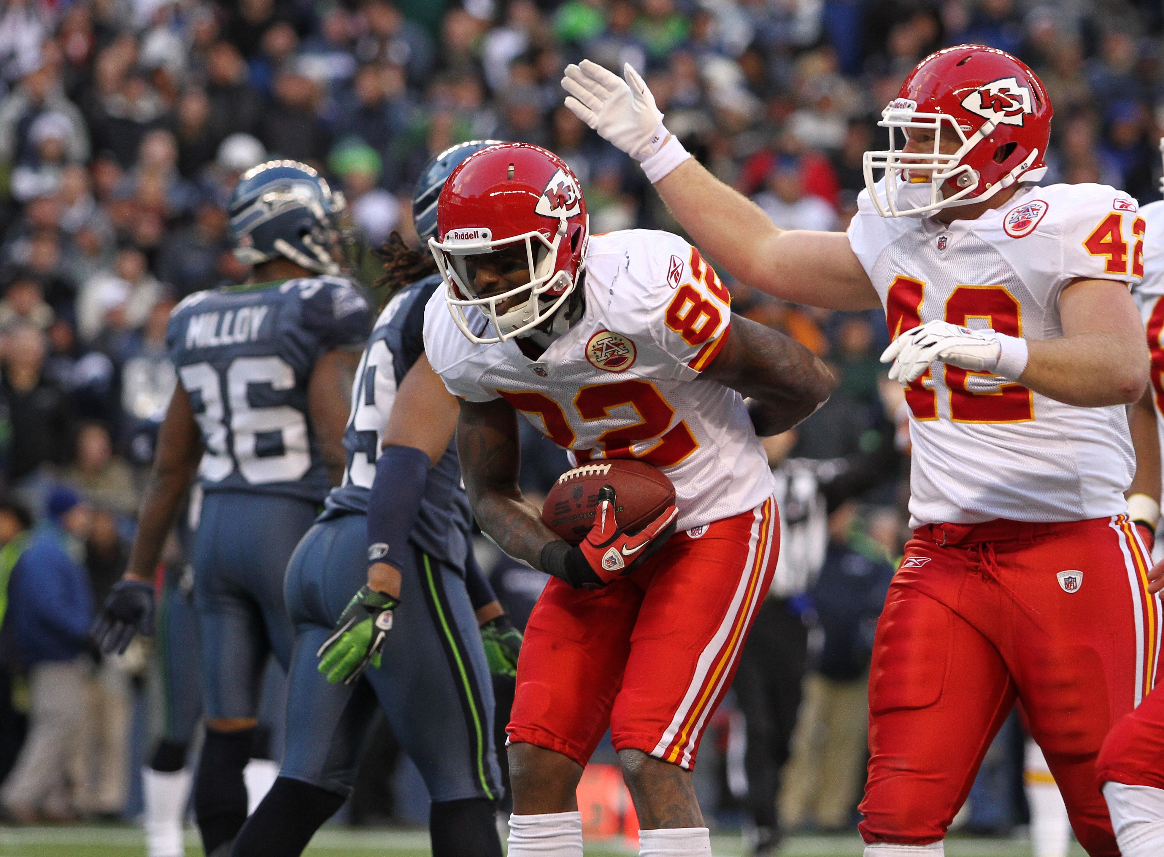 SEATTLE, WA - NOVEMBER 28:  Wide receiver Dwayne Bowe #82 of the Kansas City Chiefs takes a bow after scoring his third touchdown against the Seattle Seahawks at Qwest Field on November 28, 2010 in Seattle, Washington. Mike Cox #42 offers congratulations.