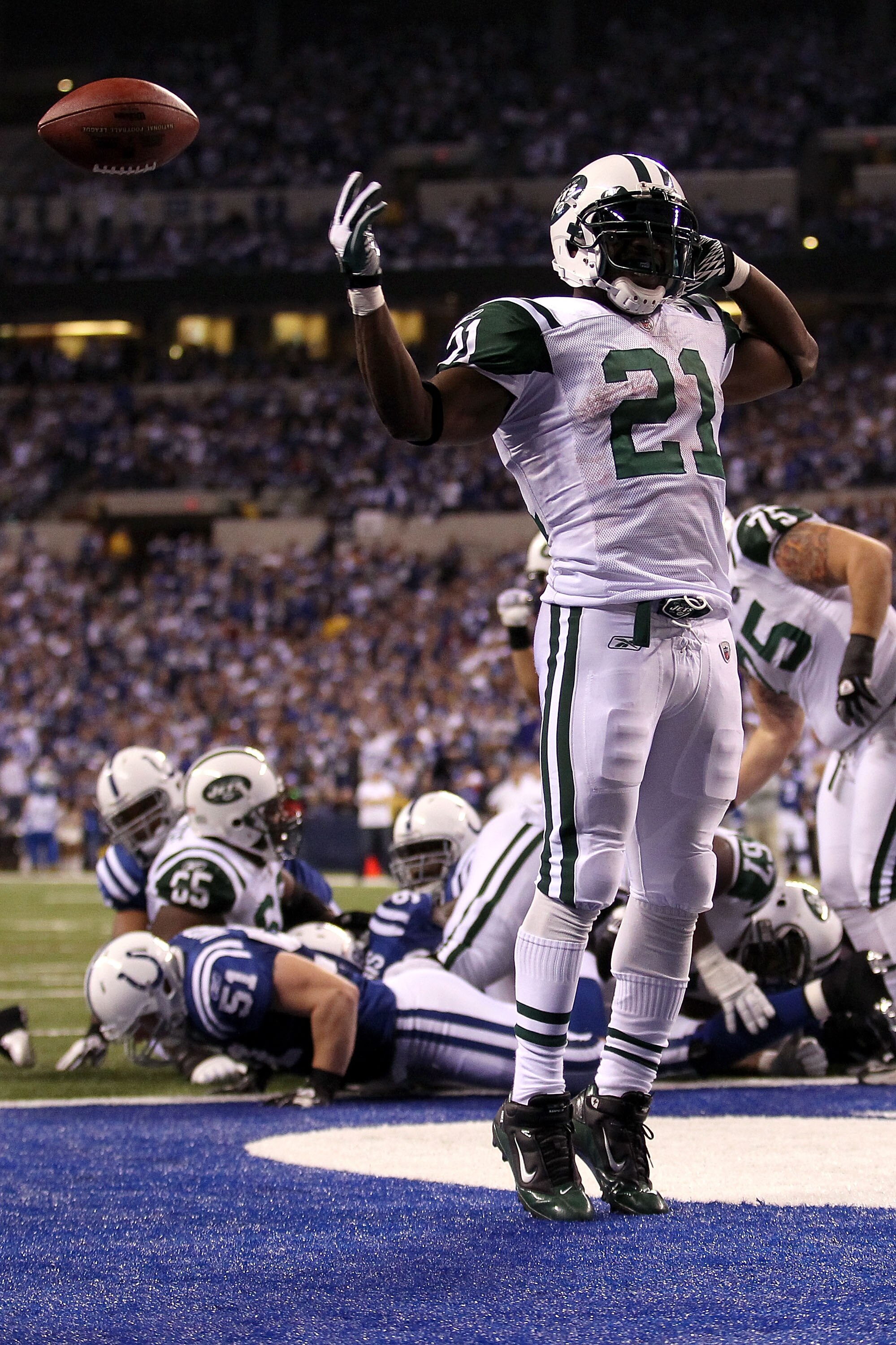 INDIANAPOLIS, IN - JANUARY 08:  LaDainian Tomlinson #21 of the New York Jets celebrates after he scored a 1-yard rushing touchdown in the fourth quarter against the Indianapolis Colts during their 2011 AFC wild card playoff game at Lucas Oil Stadium on Ja