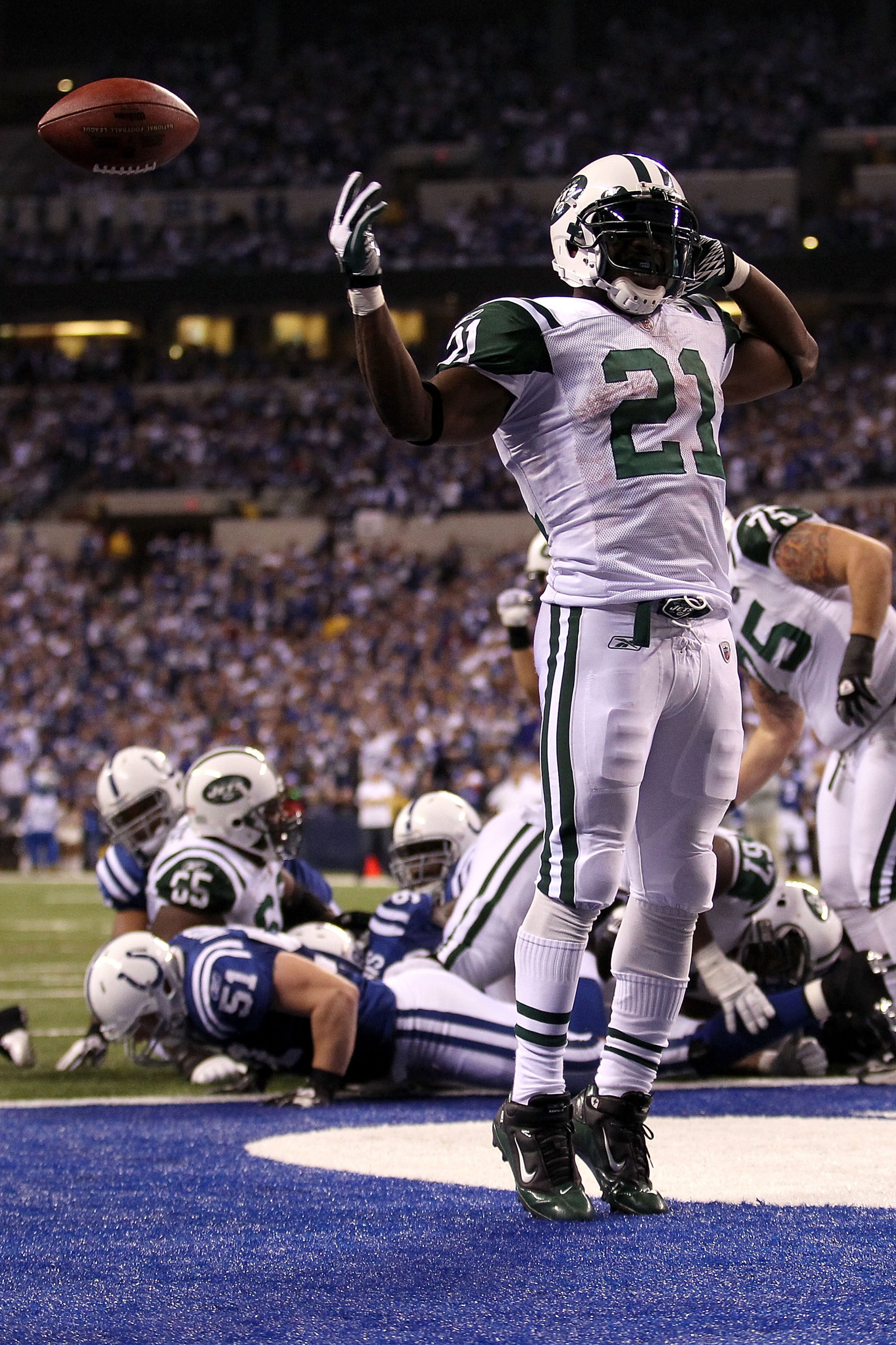 INDIANAPOLIS, IN - JANUARY 08: LaDainian Tomlinson #21 of the New York Jets celebrates after he scored a 1-yard rushing touchdown in the fourth quarter against the Indianapolis Colts during their 2011 AFC wild card playoff game at Lucas Oil Stadium on Ja INDIANAPOLIS, IN - JANUARY 08: LaDainian Tomlinson #21 of the New York Jets celebrates after he scored a 1-yard rushing touchdown in the fourth quarter against the Indianapolis Colts during their 2011 AFC wild card playoff game at Lucas Oil Stadium on Ja