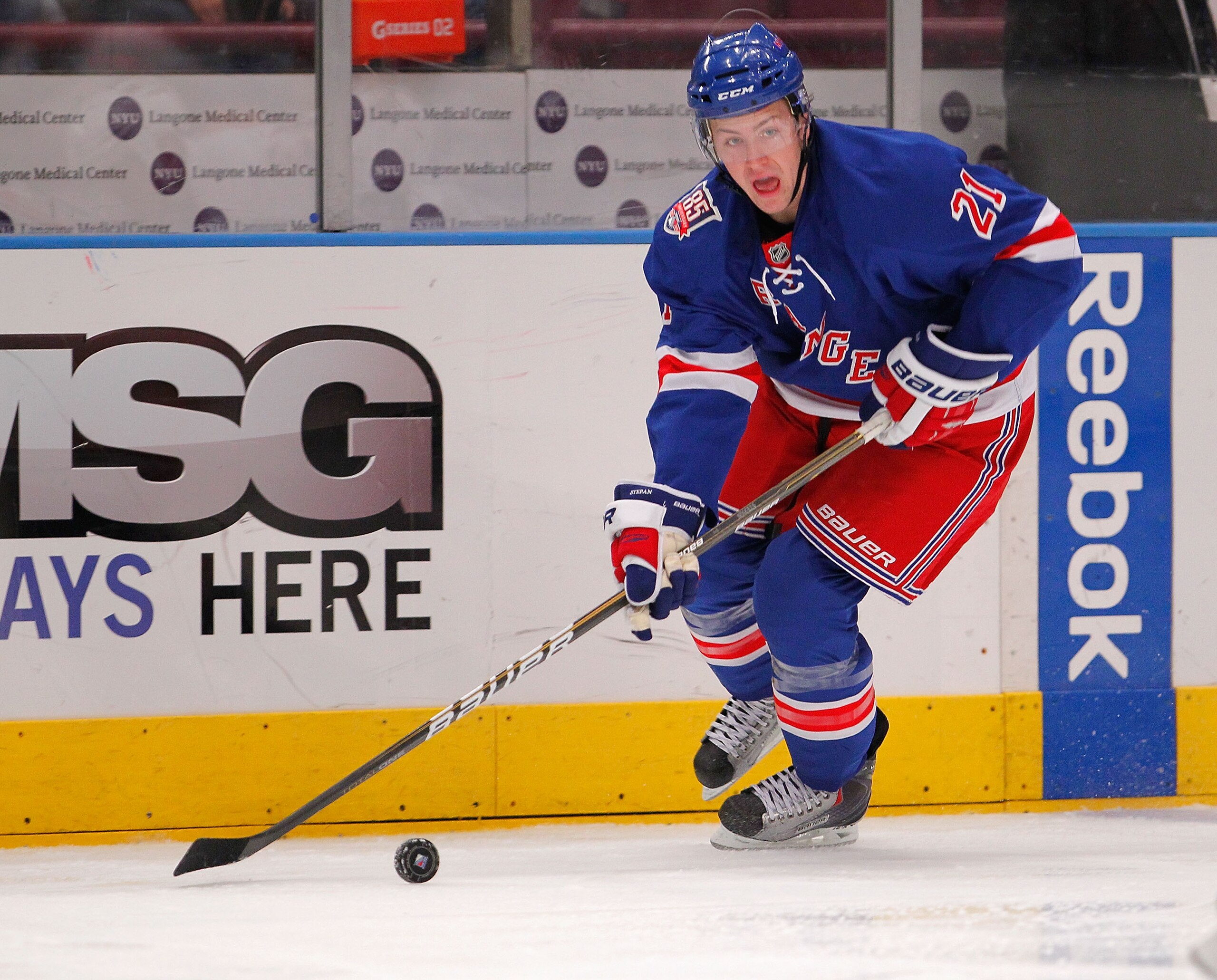 NEW YORK - NOVEMBER 14:  Derek Stepan #21 of the New York Rangers skates with the puck during a hockey game against the Edmonton Oilers at Madison Square Garden on November 14, 2010 in New York City.  (Photo by Paul Bereswill/Getty Images)