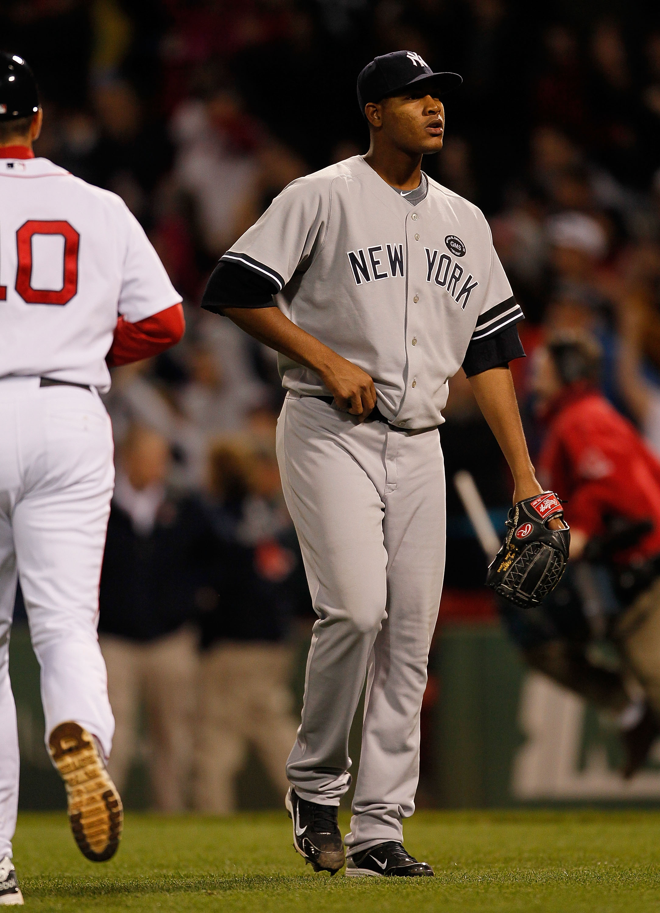 BOSTON - OCTOBER 2:  Ivan Nova #47 of the New York Yankees reacts in the tenth inning after he allowed a hit to Eric Petterson #3 of the Boston Red Sox , which knocked in the winning run in the second game of a doubleheader at Fenway Park, October 2, 2010