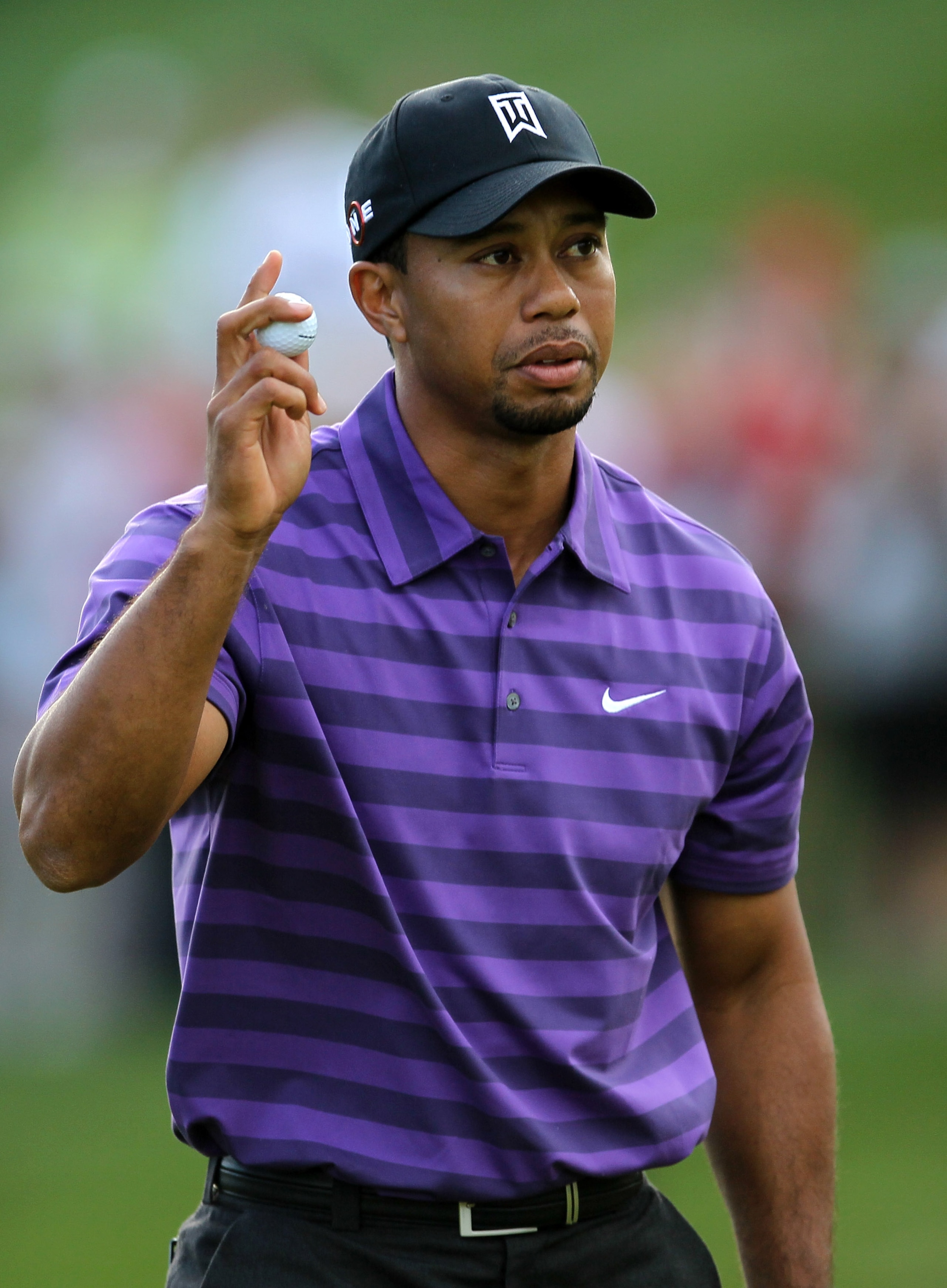 THOUSAND OAKS, CA - DECEMBER 02:  Tiger Woods holds up his ball after finishing his round on the 18th green during the Chevron World Challenge at Sherwood Country Club on December 2, 2010 in Thousand Oaks, California.  (Photo by Stephen Dunn/Getty Images)