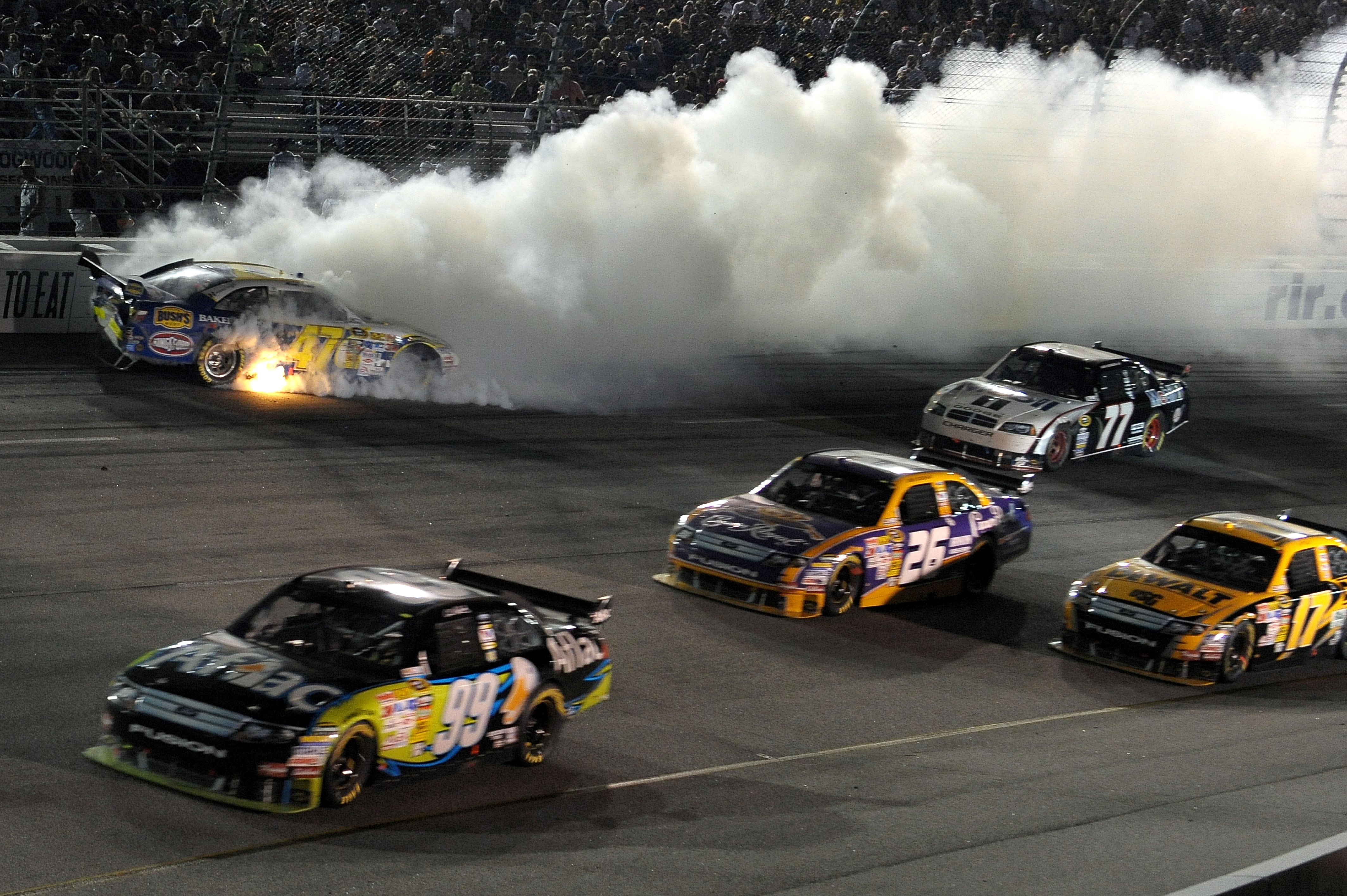 RICHMOND, VA - MAY 02:  Marcos Ambros, driver of the #47 Bush's Best Baked Beans/Kingsford/Clorox Toyota crashes in turn 2 during the NASCAR Sprint Cup Series Crown Royal Presents the Russ Friedman 400 at Richmond International Raceway on May 2, 2009 in R