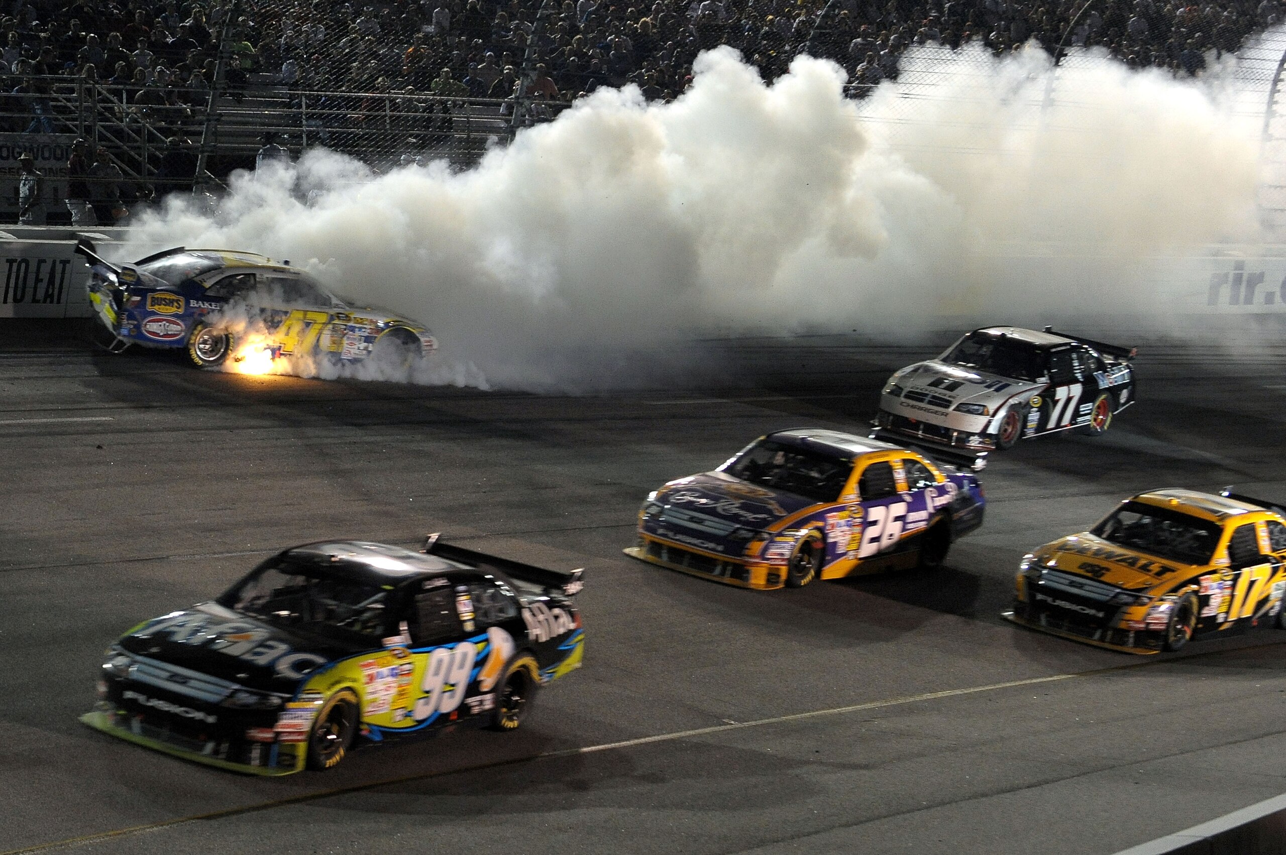 RICHMOND, VA - MAY 02: Marcos Ambros, driver of the #47 Bush's Best Baked Beans/Kingsford/Clorox Toyota crashes in turn 2 during the NASCAR Sprint Cup Series Crown Royal Presents the Russ Friedman 400 at Richmond International Raceway on May 2, 2009 in R RICHMOND, VA - MAY 02: Marcos Ambros, driver of the #47 Bush's Best Baked Beans/Kingsford/Clorox Toyota crashes in turn 2 during the NASCAR Sprint Cup Series Crown Royal Presents the Russ Friedman 400 at Richmond International Raceway on May 2, 2009 in R