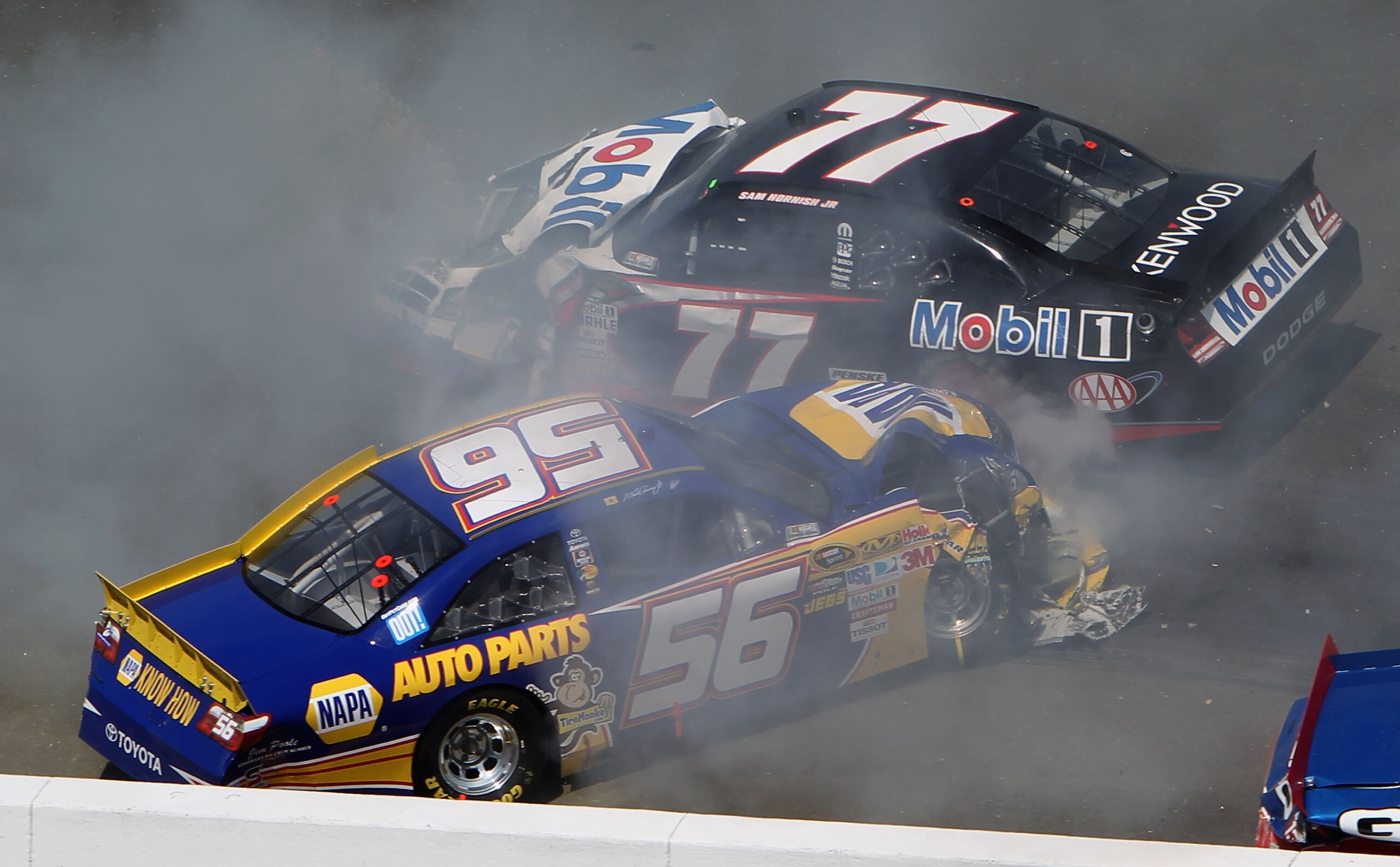 SONOMA, CA - JUNE 20: Martin Truex Jr., driver of the #56 NAPA Toyota, and Sam Hornish Jr., driver of the #77 Mobil 1 Dodge, crash during a restart in the NASCAR Sprint Cup Series Toyota/Save Mart 350 at Infineon Raceway on June 20, 2010 in Sonoma, Calif SONOMA, CA - JUNE 20: Martin Truex Jr., driver of the #56 NAPA Toyota, and Sam Hornish Jr., driver of the #77 Mobil 1 Dodge, crash during a restart in the NASCAR Sprint Cup Series Toyota/Save Mart 350 at Infineon Raceway on June 20, 2010 in Sonoma, Calif
