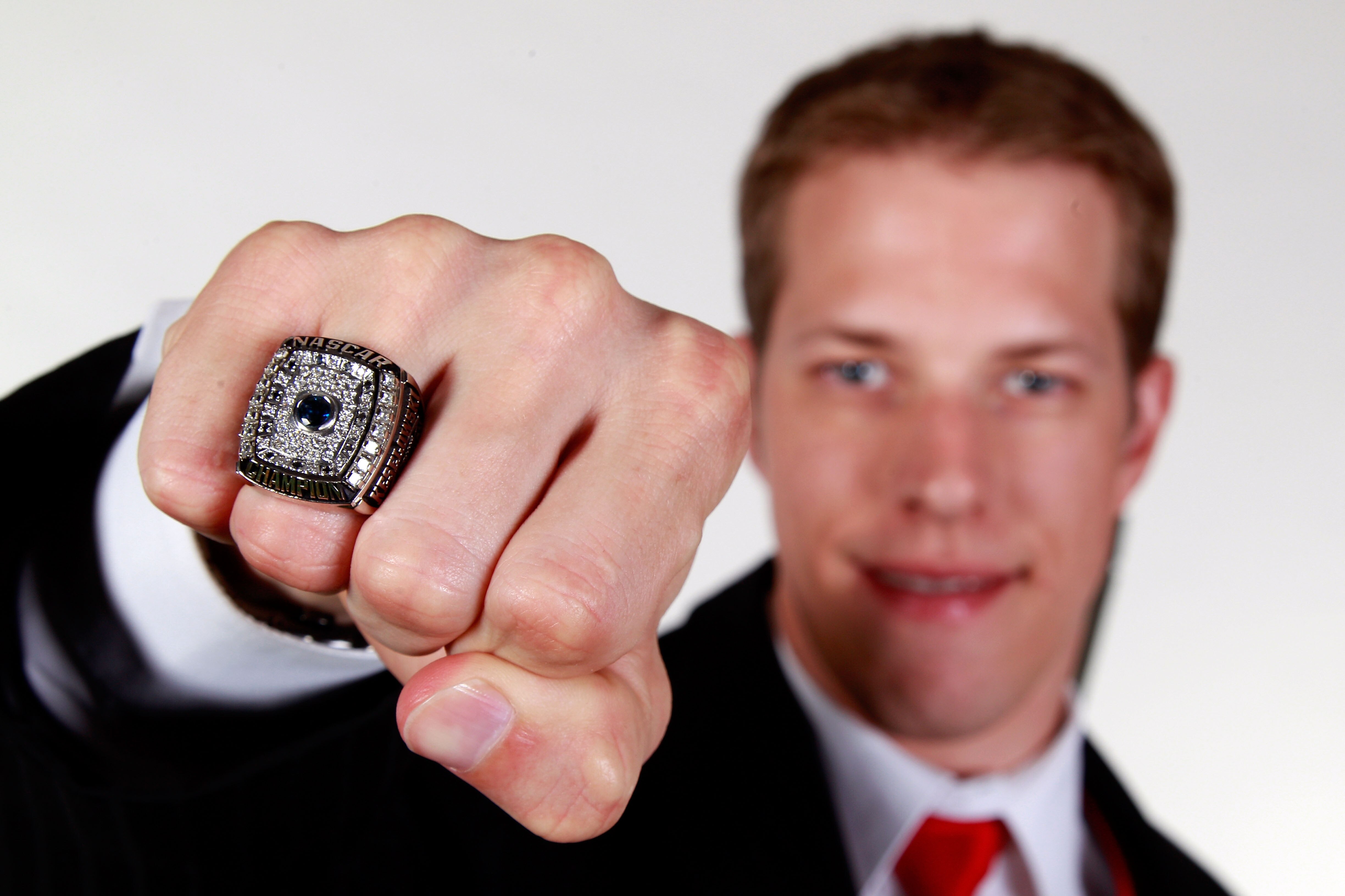 MIAMI - NOVEMBER 22:  2010 Nationwide Series Champion Brad Keselowski, driver of the #22 Discount Tire Dodge, poses after receiving the Nationwide Series Champions ring during the NASCAR Nationwide/Camping World Truck Series Banquet at Loews Miami Beach H