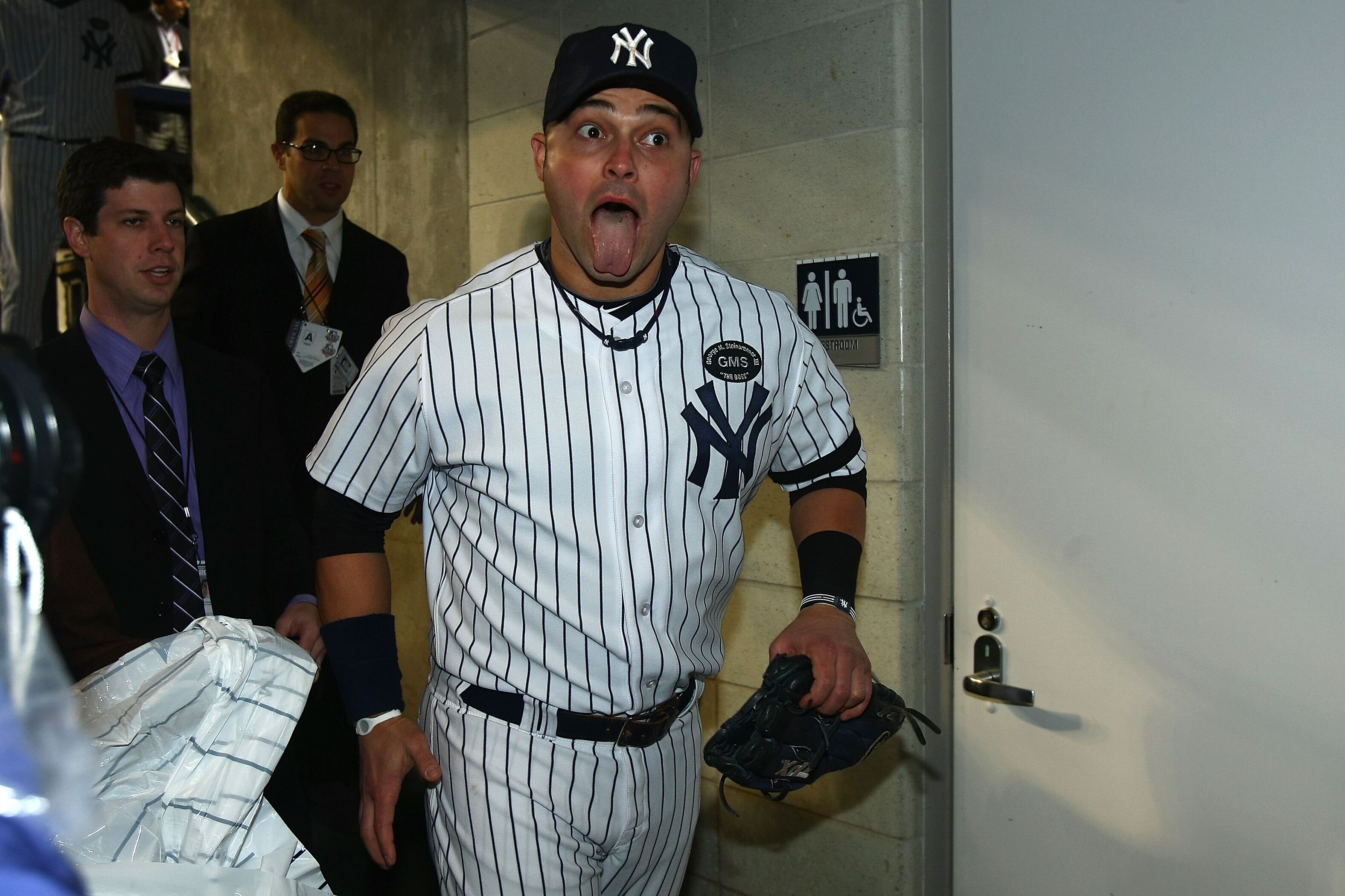 NEW YORK - OCTOBER 09:  Nick Swisher #33 of the New York Yankees celebrates in the locker room after the Yankees won 6-1 against the Minnesota Twins during Game Three of the ALDS part of the 2010 MLB Playoffs at Yankee Stadium on October 9, 2010 in the Br
