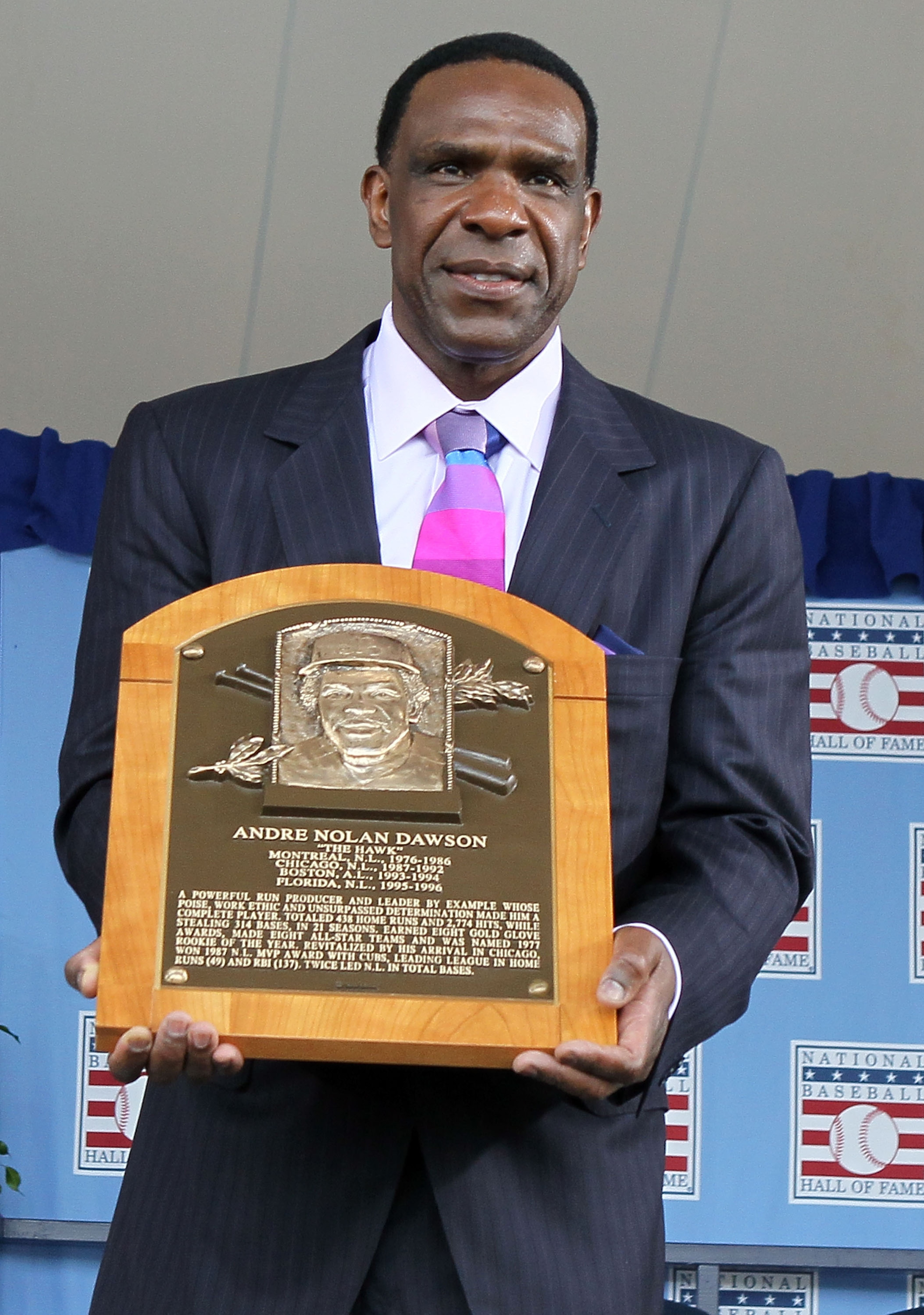 COOPERSTOWN, NY - JULY 25:  2010 inductee Andre Dawson poses for a photograph with his plaque at Clark Sports Center during the Baseball Hall of Fame induction ceremony on July 25, 20010 in Cooperstown, New York. Dawson was an eight time all-star during h