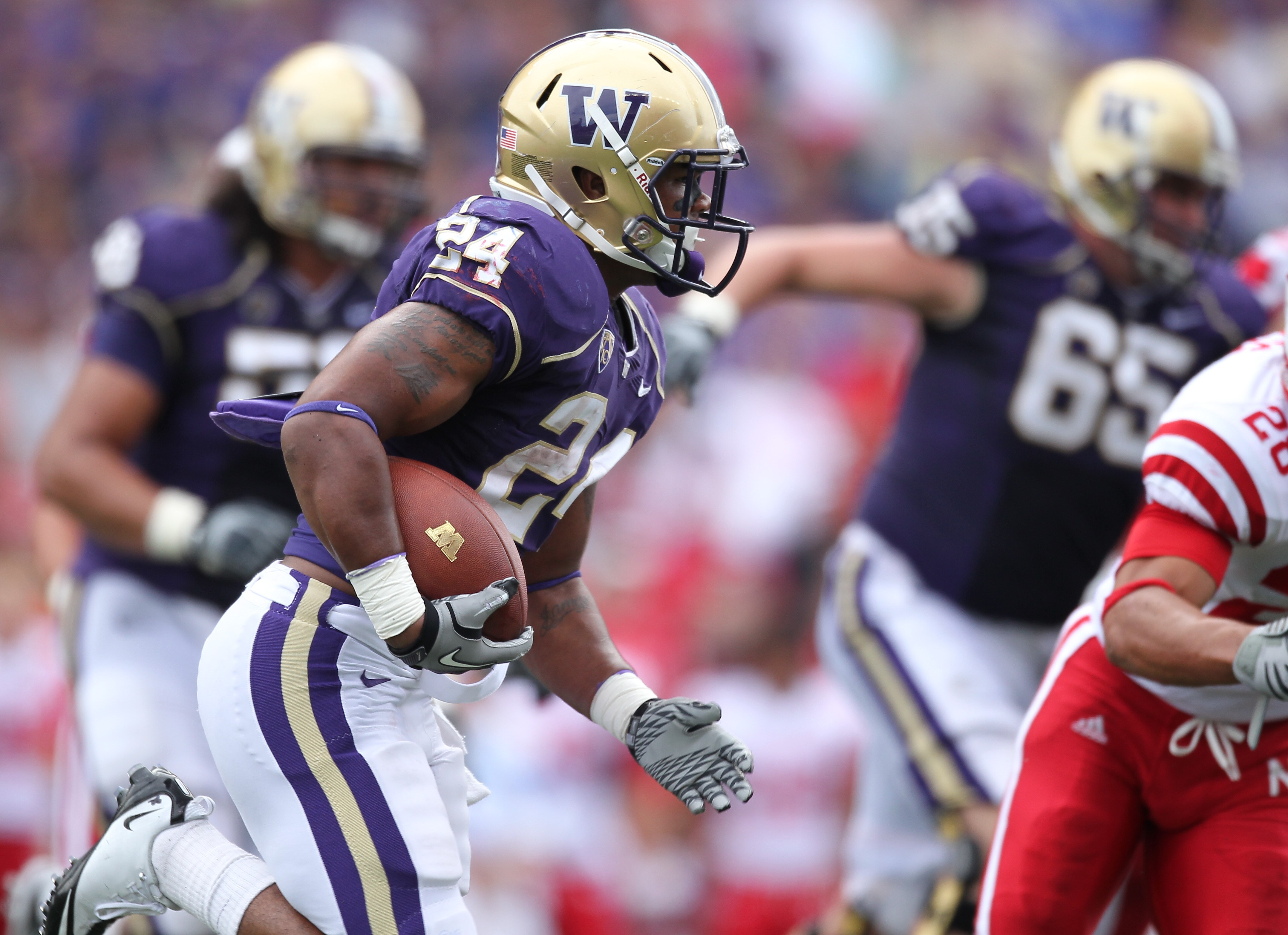 SEATTLE - SEPTEMBER 18: Running back Jesse Callier #24 of the Washington Huskies rushes against the Nebraska Cornhuskers on September 18, 2010 at Husky Stadium in Seattle, Washington. (Photo by Otto Greule Jr/Getty Images)