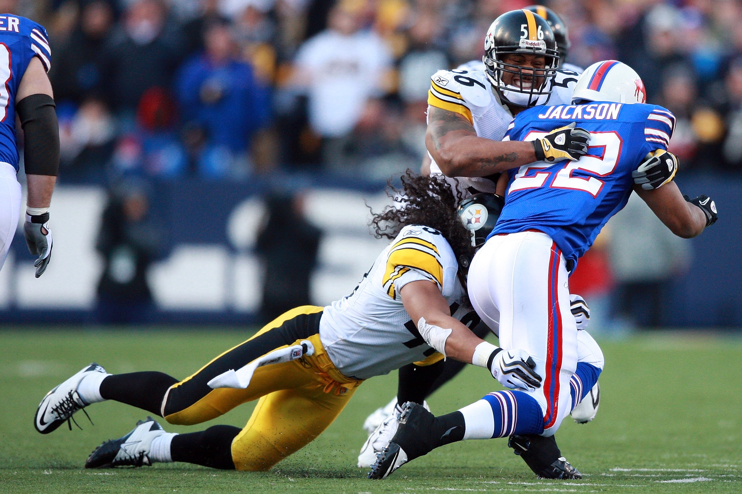 ORCHARD PARK, NY - NOVEMBER 28: Troy Polamalu #43 and Lamarr Woodley #56 of the Pittsburgh Steelers tackle Fred Jackson #22 of the Buffalo Bills during their game at Ralph Wilson Stadium on November 28, 2010 in Orchard Park, New York. (Photo by Karl Wal ORCHARD PARK, NY - NOVEMBER 28: Troy Polamalu #43 and Lamarr Woodley #56 of the Pittsburgh Steelers tackle Fred Jackson #22 of the Buffalo Bills during their game at Ralph Wilson Stadium on November 28, 2010 in Orchard Park, New York. (Photo by Karl Wal