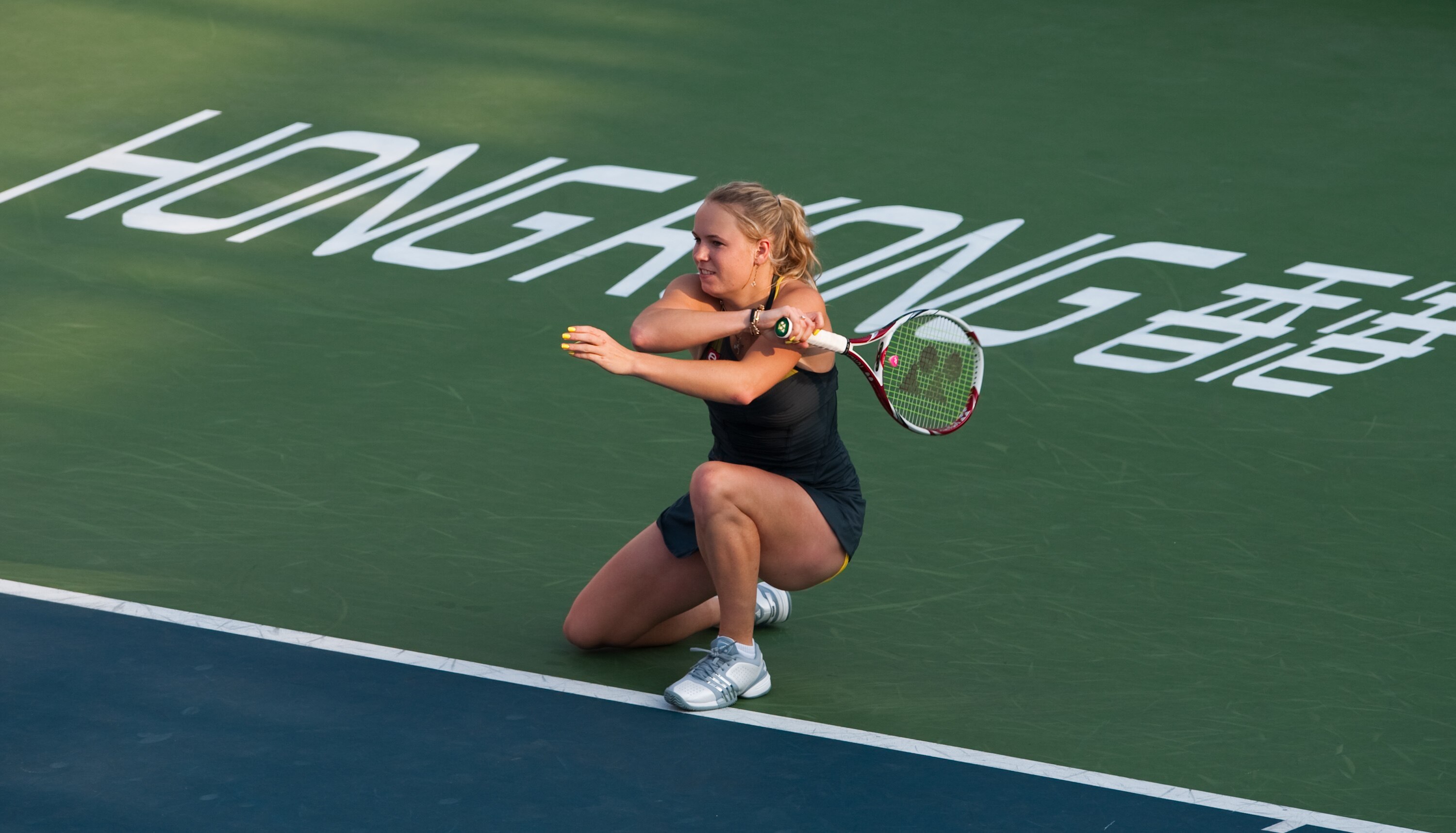 HONG KONG - JANUARY 08:  Caroline Wozniacki of Denmark in action during her match against Vera Zvonareva of Russia during day four of the Hong Kong Tennis Classic 2011 on January 8, 2011 in Hong Kong, China.  (Photo by Victor Fraile/Getty Images)
