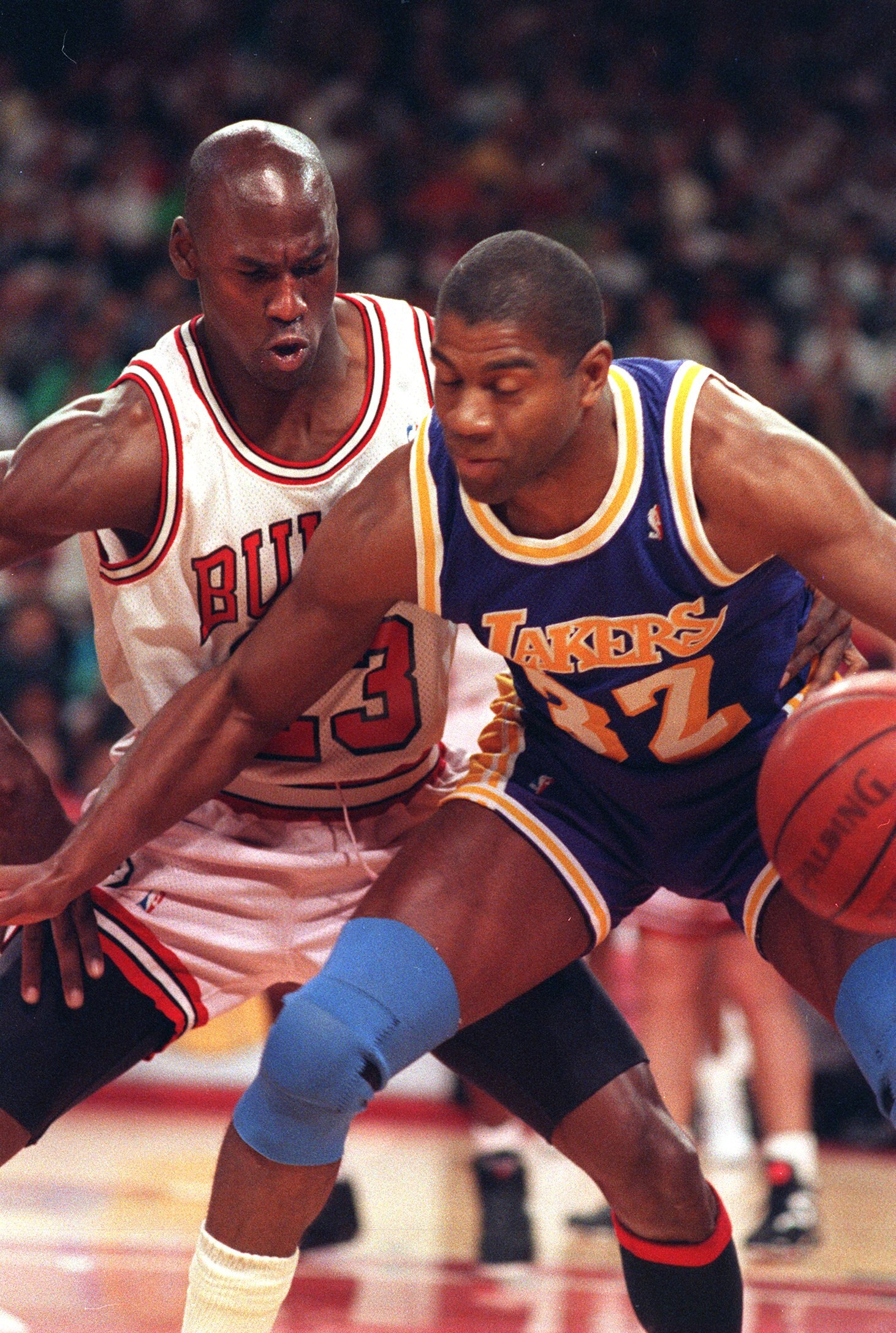 5 Jun 1991:  Magic Johnson of the Los Angeles Lakers shields the ball from Michael Jordan of the Chicago Bulls during game two of the 1991 NBA finals.   Mandatory Credit: Jonathan Daniel/ALLSPORT