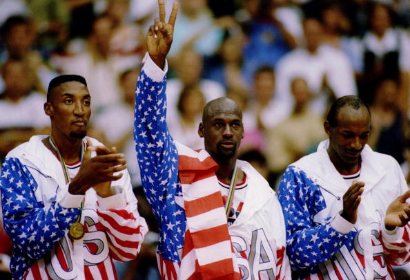 6 OCT 1992:  USA BASKETBALL TEAM MEMBERS MICHAEL JORDAN (MIDDLE) SCOTTIE PIPPEN (LEFT) AND CLIDE DREXLER (RIGHT) ACKNOWLEDGE THE CROWD AFTER RECEIVING THEIR GOLD MEDALAS MEMBERS OF THE DREAM TEAM DURING THE 1992 BARCELONA OLYMPICS IN BARCELONA, SPAIN. Man
