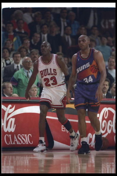 1992-1993:  Guard Michael Jordan of the Chicago Bulls (left) and forward Charles Barkley of the Phoenix Suns walk down the court during a game at the United Center in Chicago, Illinois. Mandatory Credit: Jonathan Daniel  /Allsport