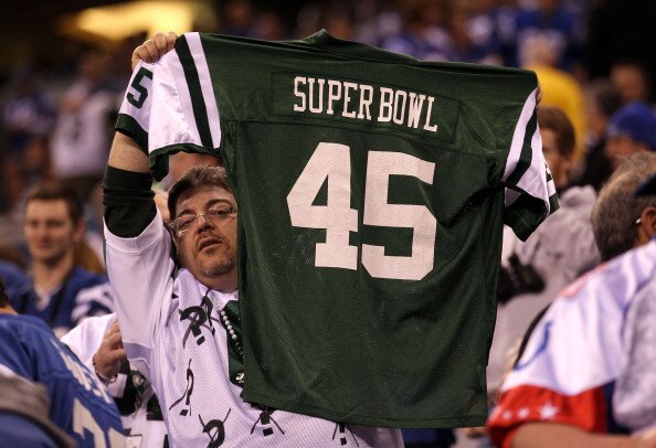 INDIANAPOLIS, IN - JANUARY 08:  A fan of the New York Jets holds up a Jets Jersey which reads 'Super Bowl 45' against the Indianapolis Colts during their 2011 AFC wild card playoff game at Lucas Oil Stadium on January 8, 2011 in Indianapolis, Indiana. The