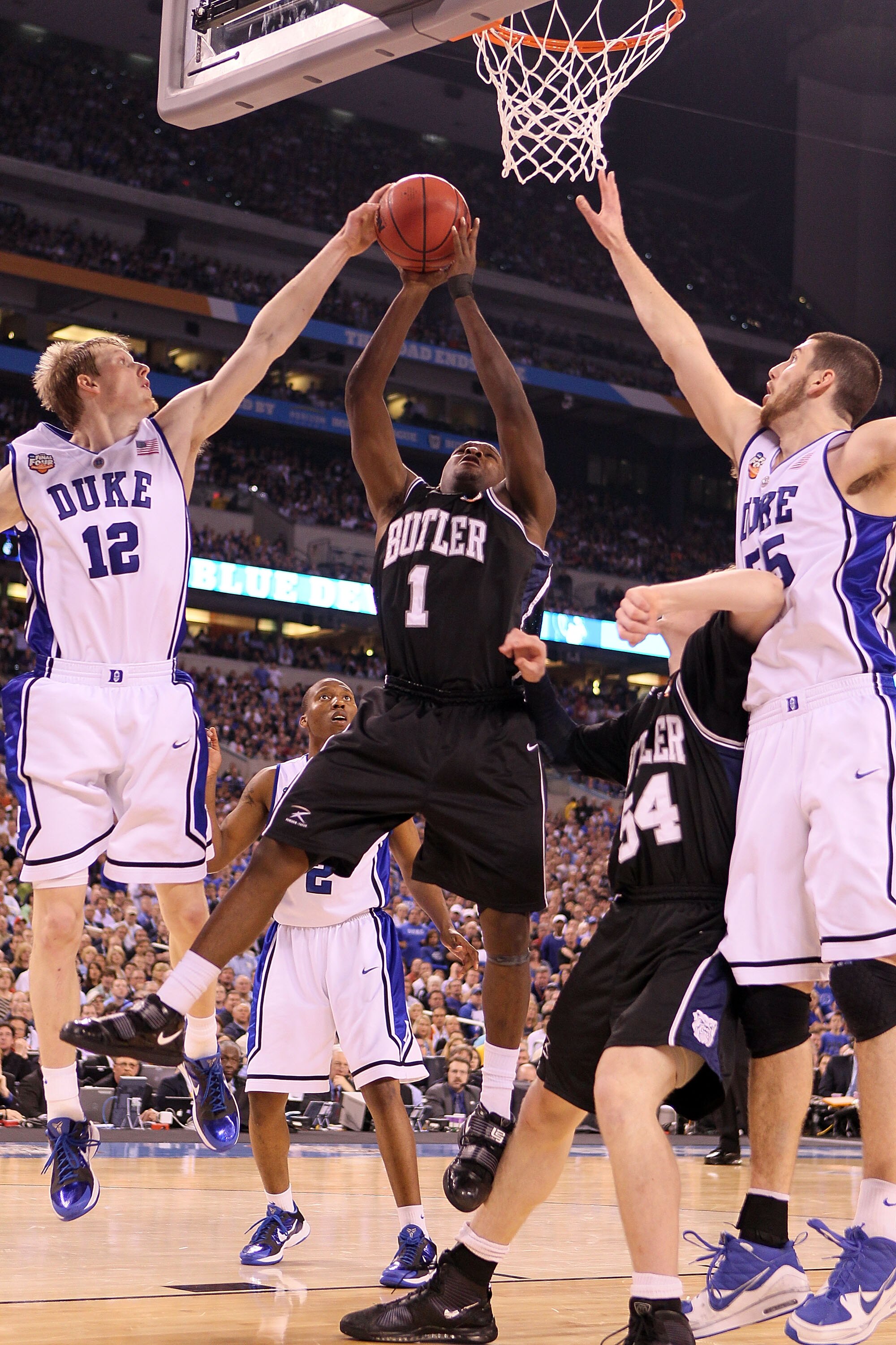 INDIANAPOLIS - APRIL 05:  Shelvin Mack #1 of the Butler Bulldogs goes up for a shot against Kyle Singler #12 of the Duke Blue Devils during the 2010 NCAA Division I Men's Basketball National Championship game at Lucas Oil Stadium on April 5, 2010 in India