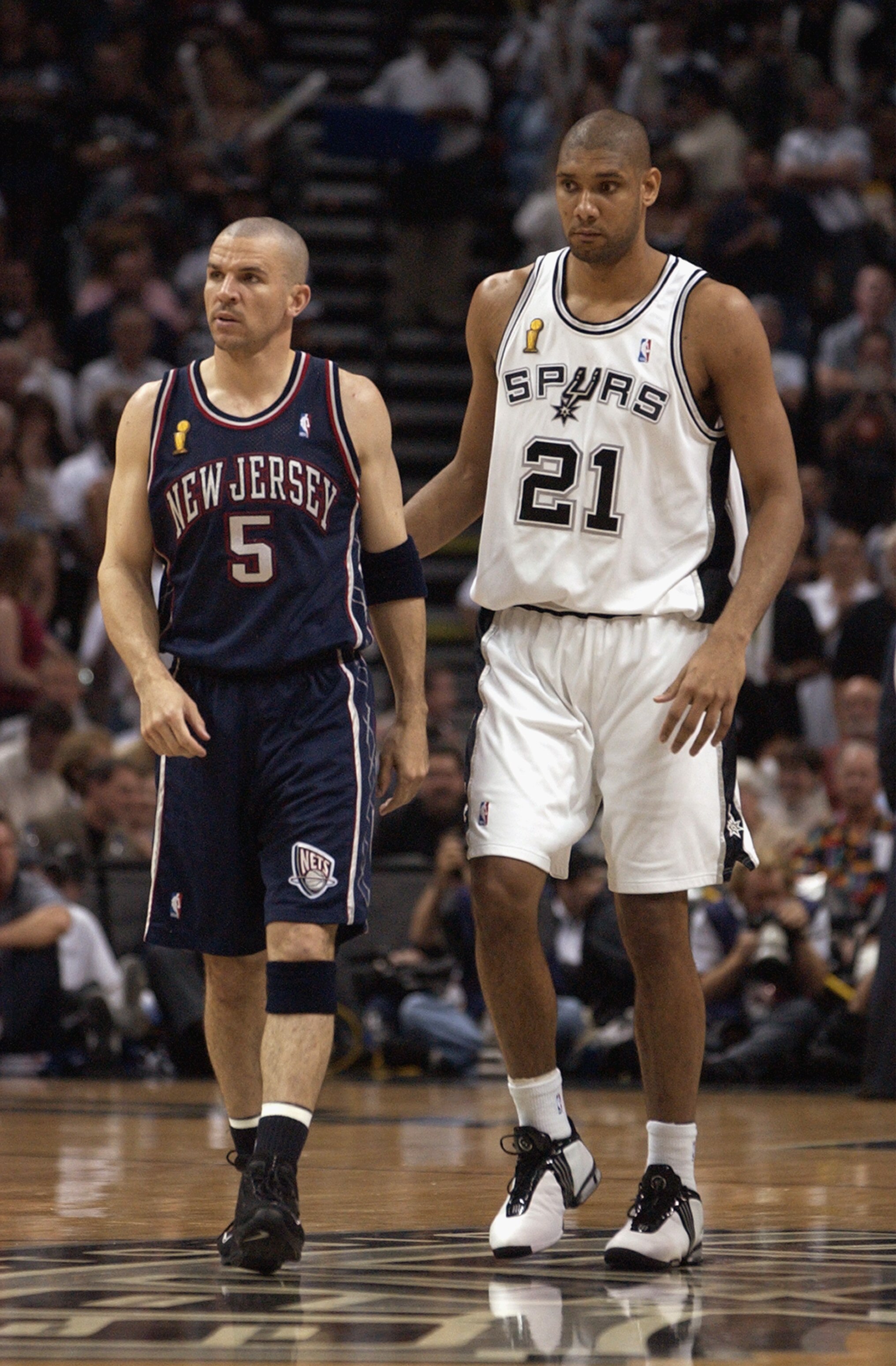 SAN ANTONIO - JUNE 6:  Jason Kidd #5 of the New Jersey Nets and Tim Duncan #21 of the San Antonio Spurs walks during Game two of the 2003 NBA Finals at SBC Center on June 6, 2003 in San Antonio, Texas.  The Nets won 87-85.  NOTE TO USER: User expressly ac