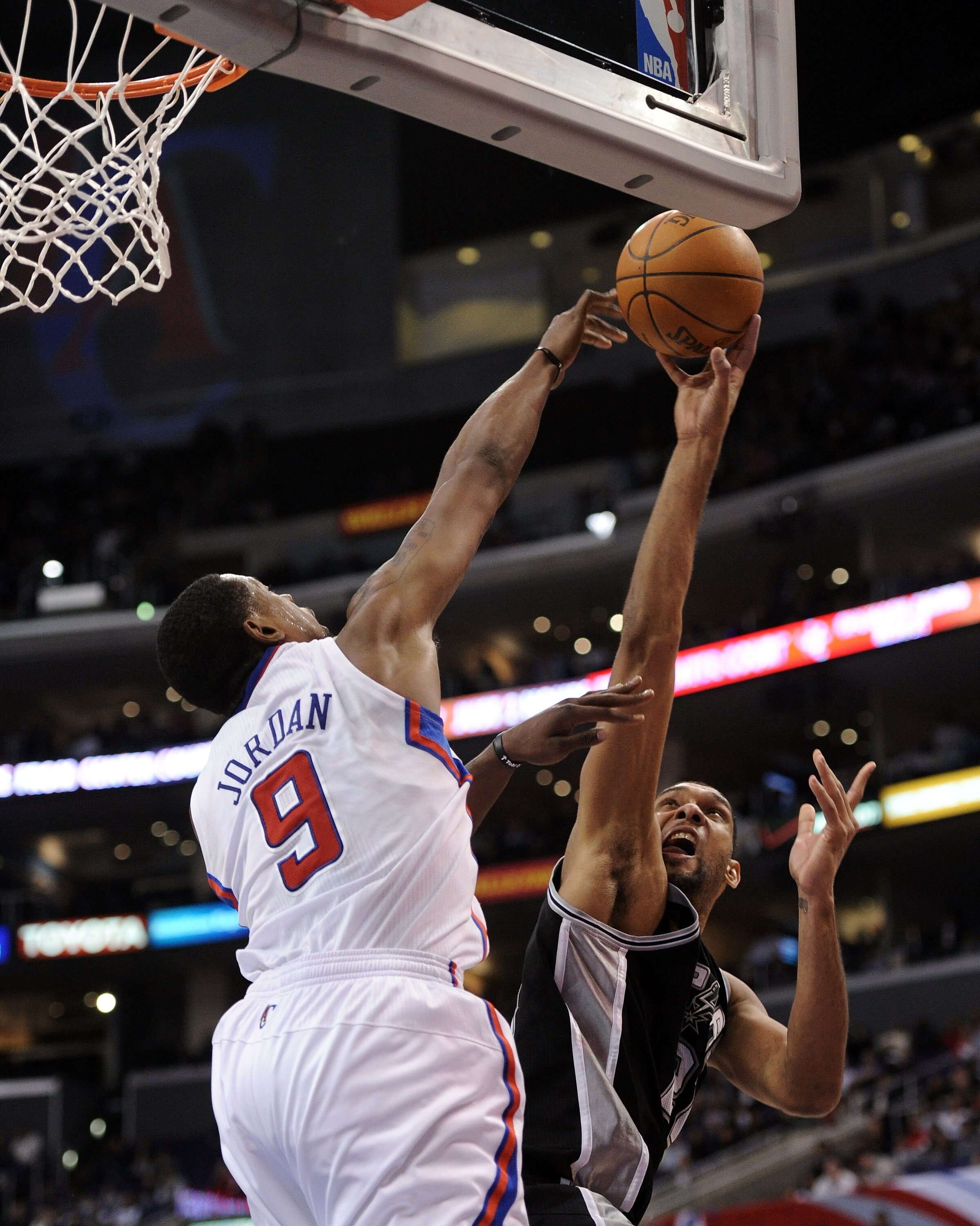 LOS ANGELES, CA - DECEMBER 01:  Tim Duncan #21 of the San Antonio Spurs has his shot blocked by DeAndre Jordan #9 of the Los Angeles Clippers during a 90-85 Clipper victory at the Staples Center on December 1, 2010 in Los Angeles, California.  NOTE TO USE