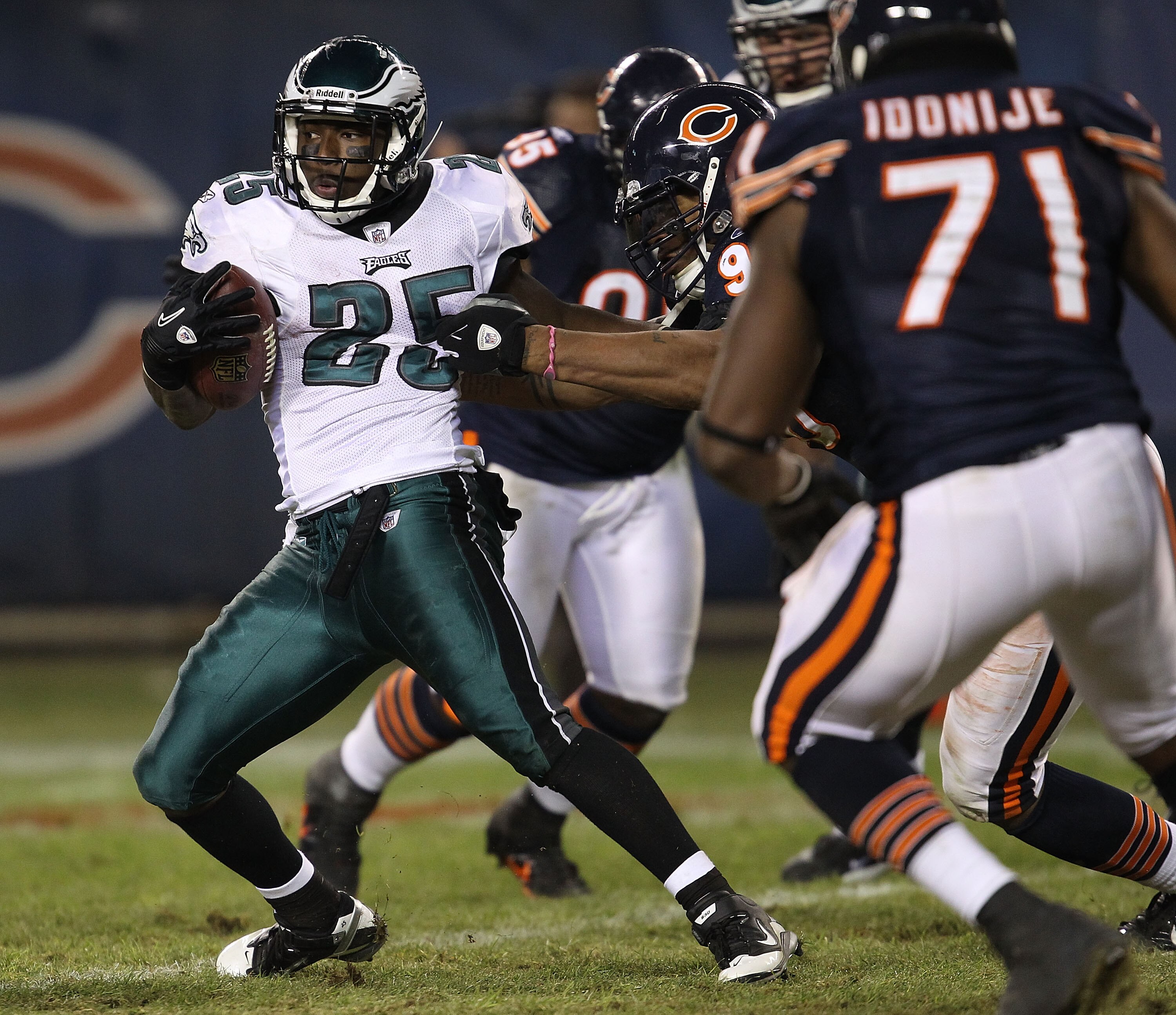 CHICAGO - NOVEMBER 28: LeSean McCoy #25 of the Philadelphia Eagles tries to escape Julius Peppers #90 and Israel Idonije #71 of the Chicago Bears at Soldier Field on November 28, 2010 in Chicago, Illinois. The Bears defeated the Eagles 31-26. (Photo by Jo