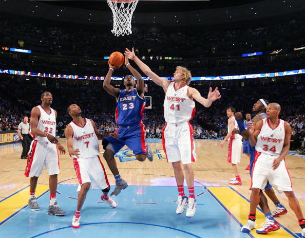 DENVER - FEBRUARY 20:   LeBron James #23 of the Eastern Conference All-Stars goes up for a shot over Rashard Lewis #7 and Dirk Nowitzki #41 of the Western Conference All-Stars during the 54th All-Star Game, part of 2005 NBA All-Star Weekend at Pepsi Cente