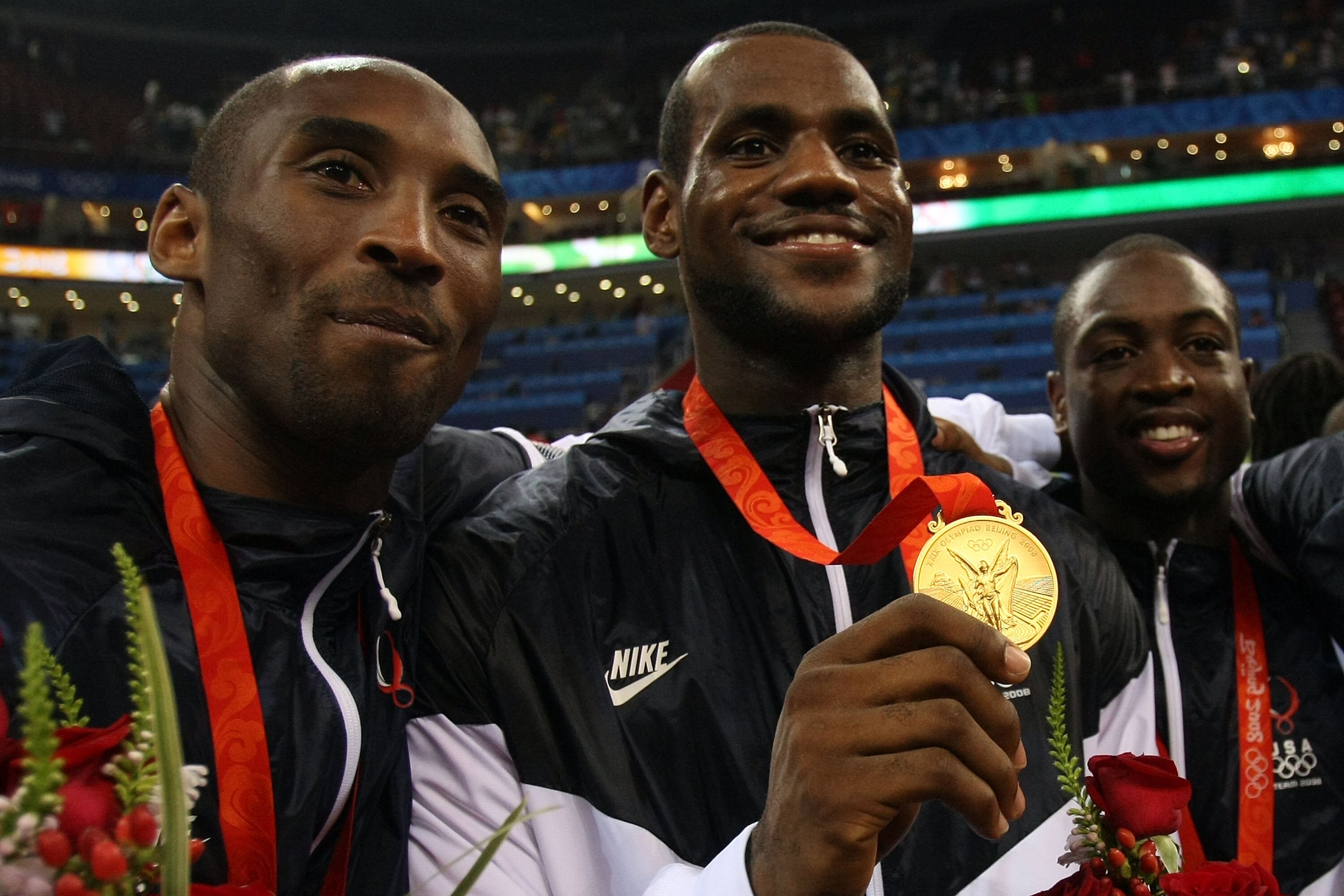 BEIJING - AUGUST 24:  (L-R) Kobe Bryant #10, LeBron James #6 and Dwyane Wade #9 of the United States hold up their medals after defeating Spain in the gold medal game during Day 16 of the Beijing 2008 Olympic Games at the Beijing Olympic Basketball Gymnas