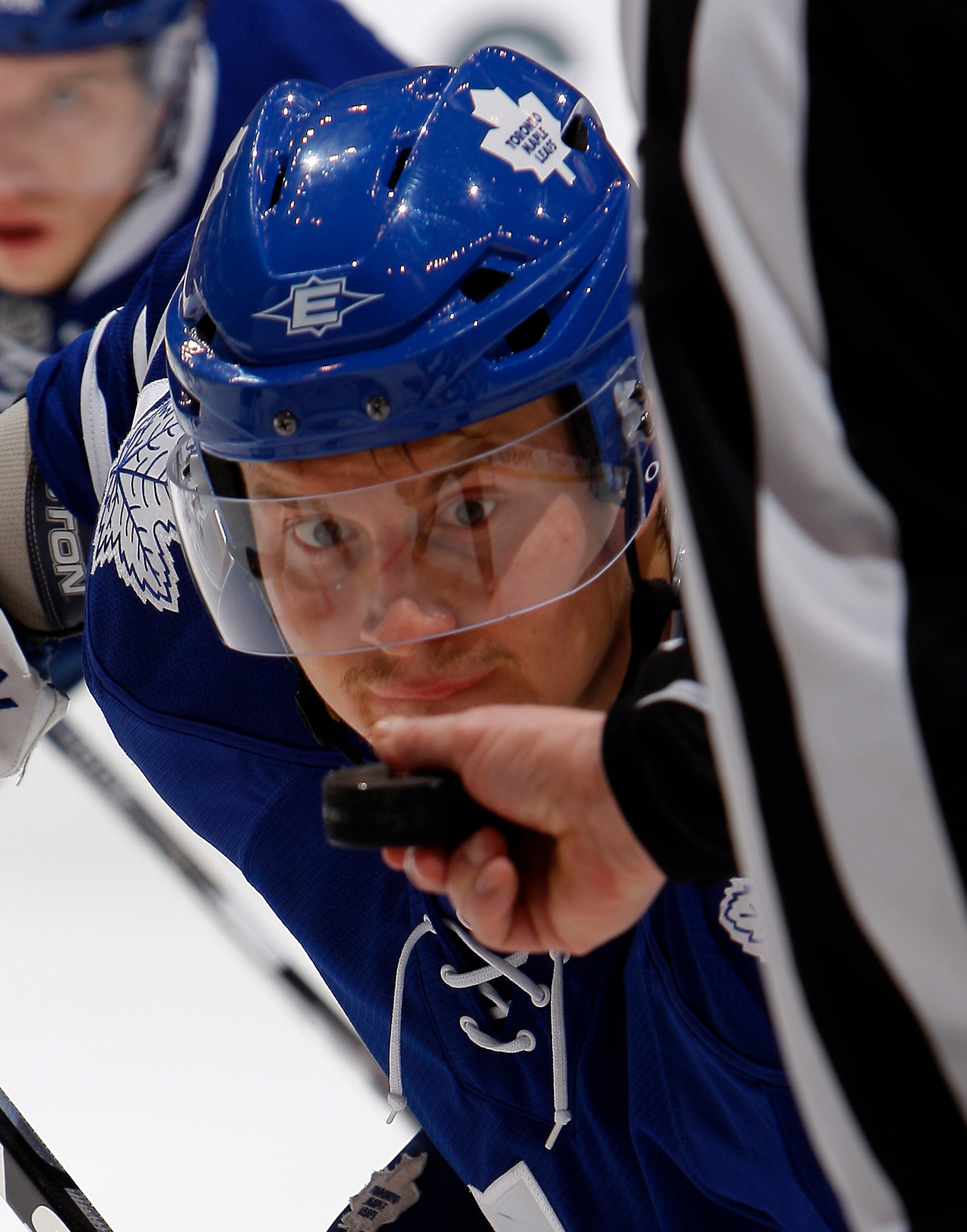 TORONTO, CANADA - JANUARY 15:  Mikhail Grabovski #84 of the Toronto Maple Leafs watches the puck during a faceoff against the Calgary Flames during game action at the Air Canada Centre January 15, 2011 in Toronto, Ontario, Canada. (Photo by Abelimages/Get