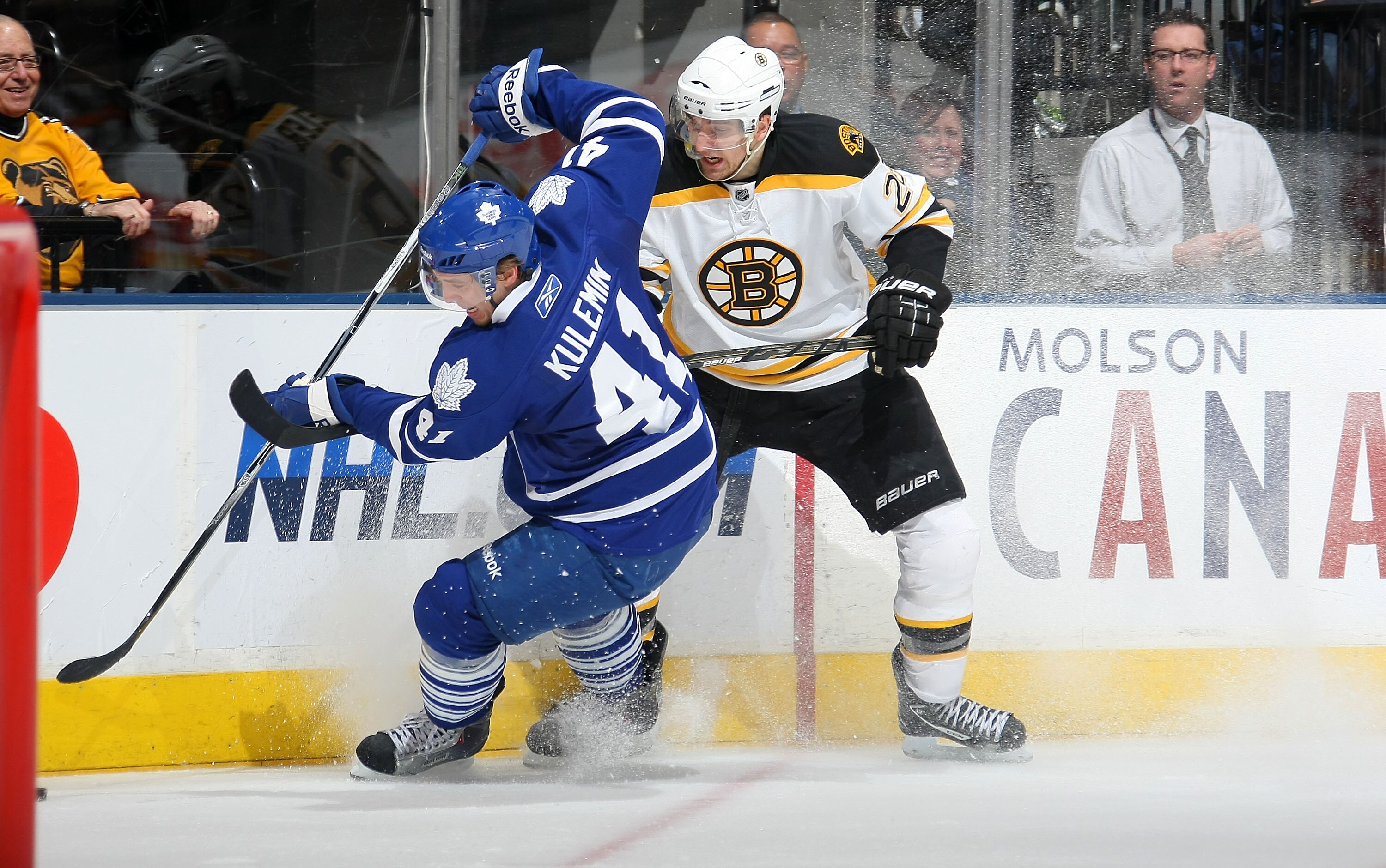 TORONTO,CANADA - JANUARY 3:  Blake Wheeler #26 of the Boston Bruins battles for the puck with Nikolai Kulemin #41 of the Toronto Maple Leafs during their NHL game at Air Canada Centre on January 3, 2011 in Toronto, Ontario, Canada.(Photo By Dave Sandford/