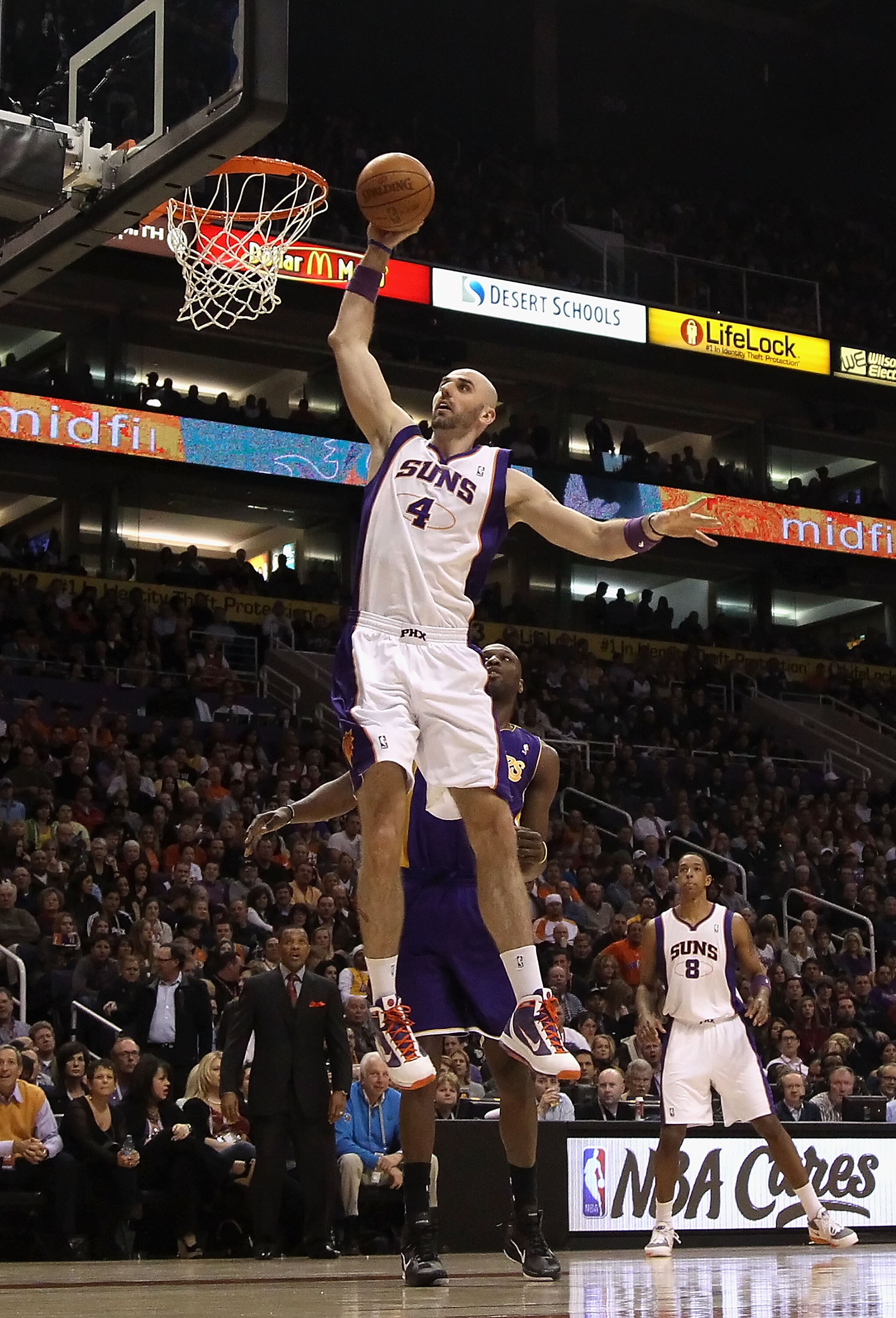 PHOENIX, AZ - JANUARY 05:  Marcin Gortat #4 of the Phoenix Suns slam dunks the ball during the NBA game against the Los Angeles Lakers at US Airways Center on January 5, 2011 in Phoenix, Arizona. The Lakers defeated the Suns 99-95.  NOTE TO USER: User exp