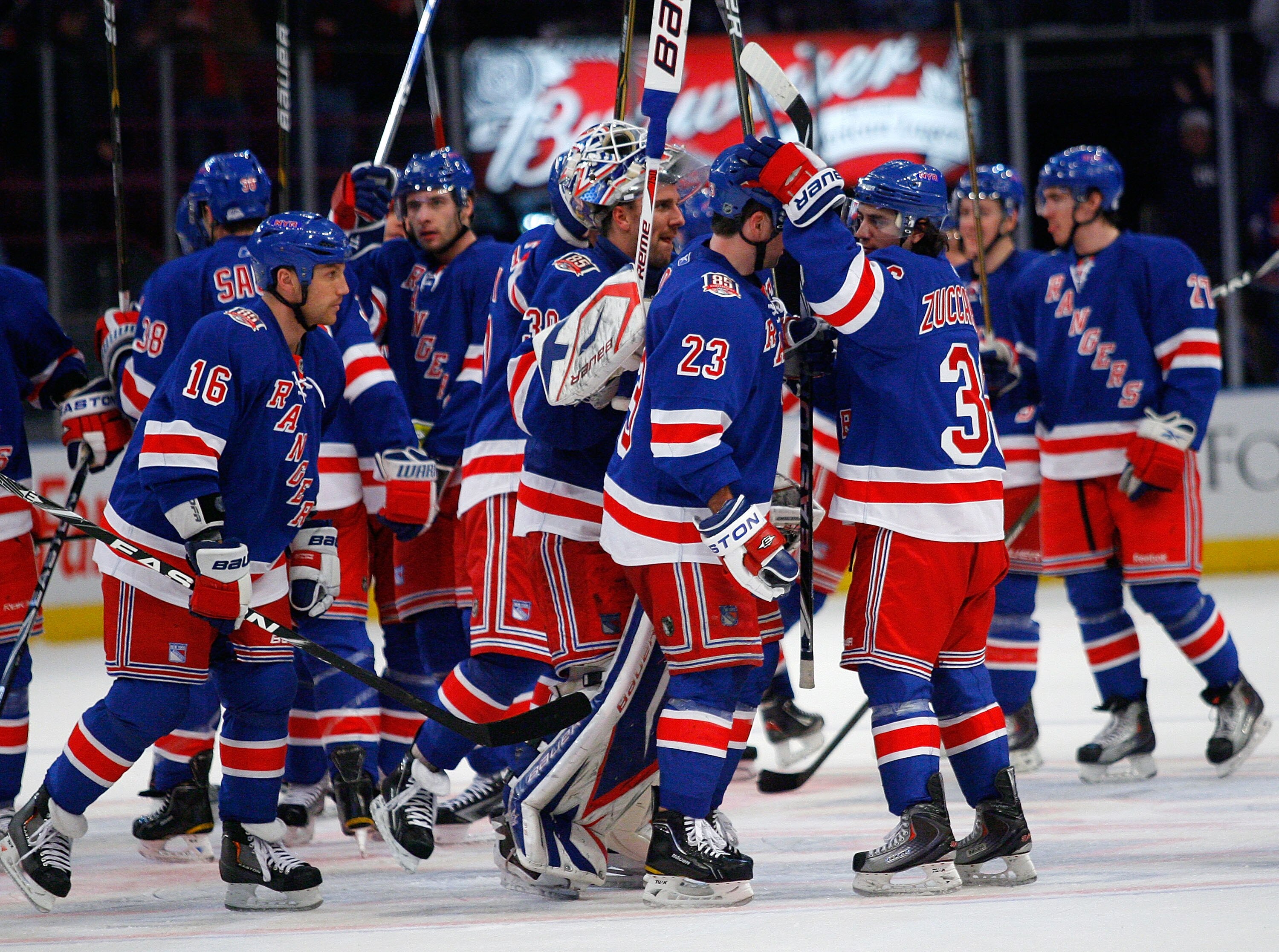 NEW YORK , NY - JANUARY 13: Goaltender Henrik Lundqvist #30 of the New York Rangers celebrates with his teammates after shutting out the Vancouver Canucks at Madison Square Garden on January 13, 2011 in New York City. The Rangers defeated the Canucks 1-0.