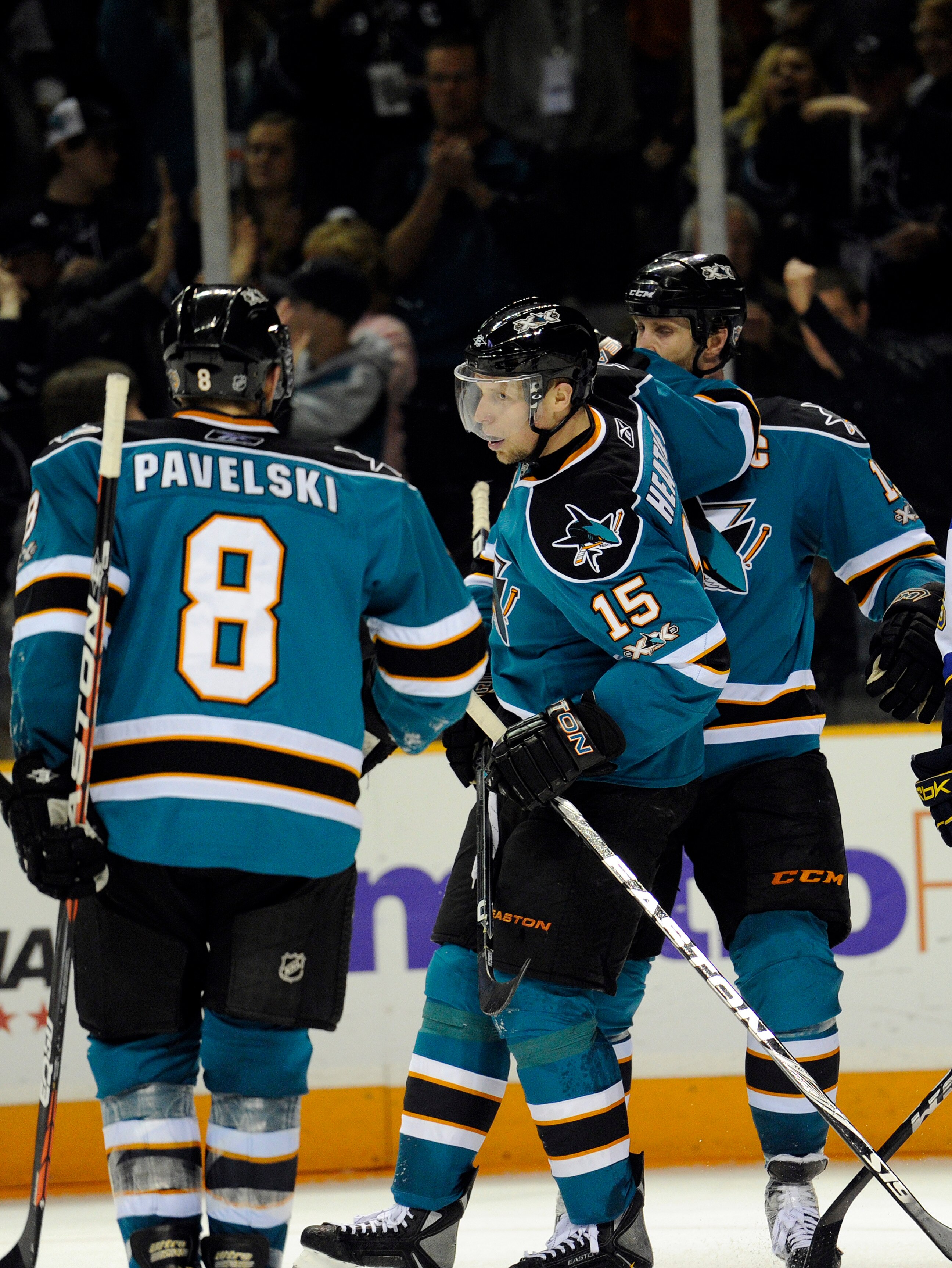 SAN JOSE, CA - JANUARY 15:  Dany Heatley #15 of the San Jose Sharks celebrates with Joe Thornton #19 and Joe Pavelski #8 after he scored a goal against the St. Louis Blues in the second period of an NHL hockey game at the HP Pavilion on January 15, 2011 i