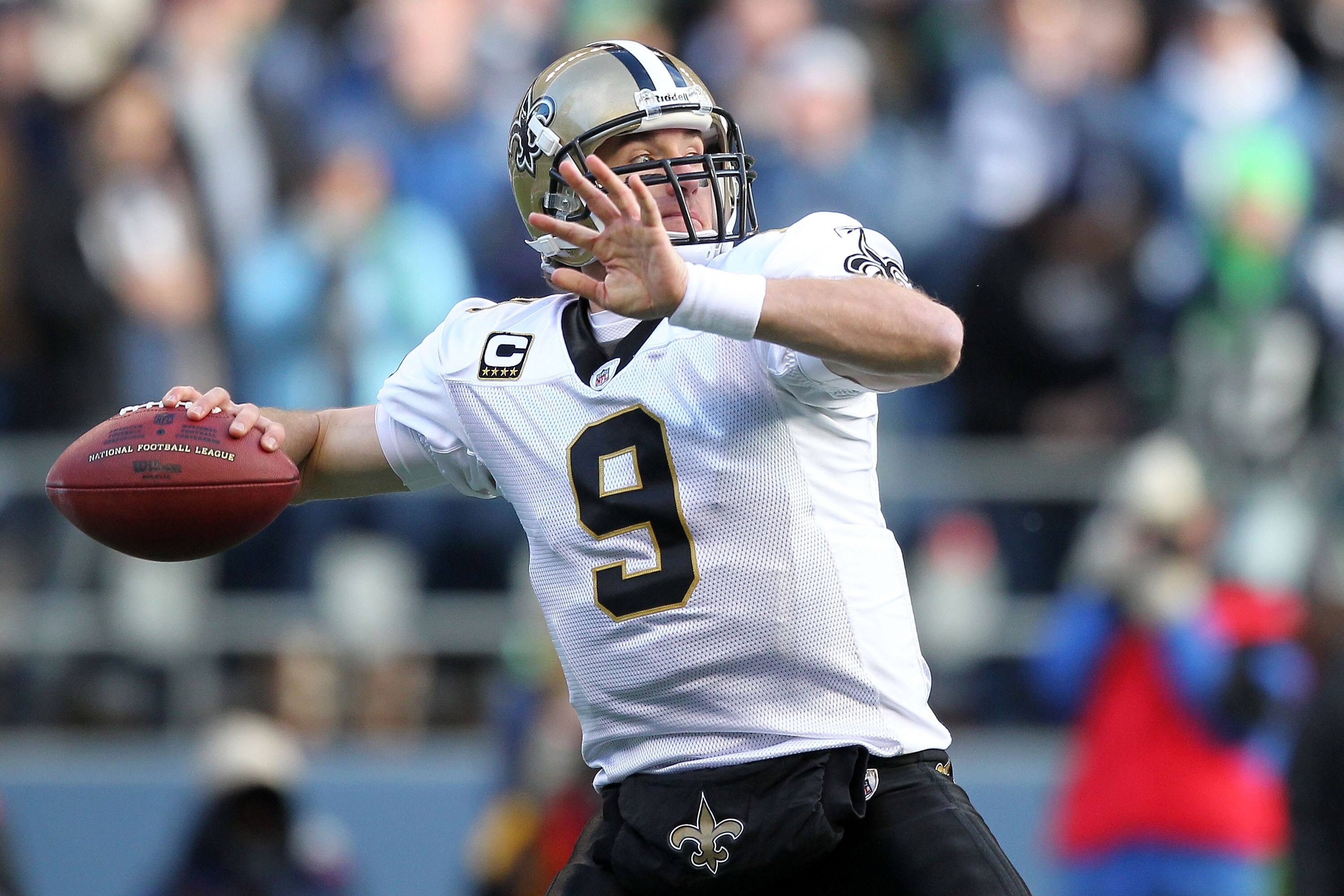 SEATTLE, WA - JANUARY 08:  Quarterback Drew Brees #9 of the New Orleans Saints throws the ball against the Seattle Seahawks during the 2011 NFC wild-card playoff game at Qwest Field on January 8, 2011 in Seattle, Washington.  (Photo by Otto Greule Jr/Gett