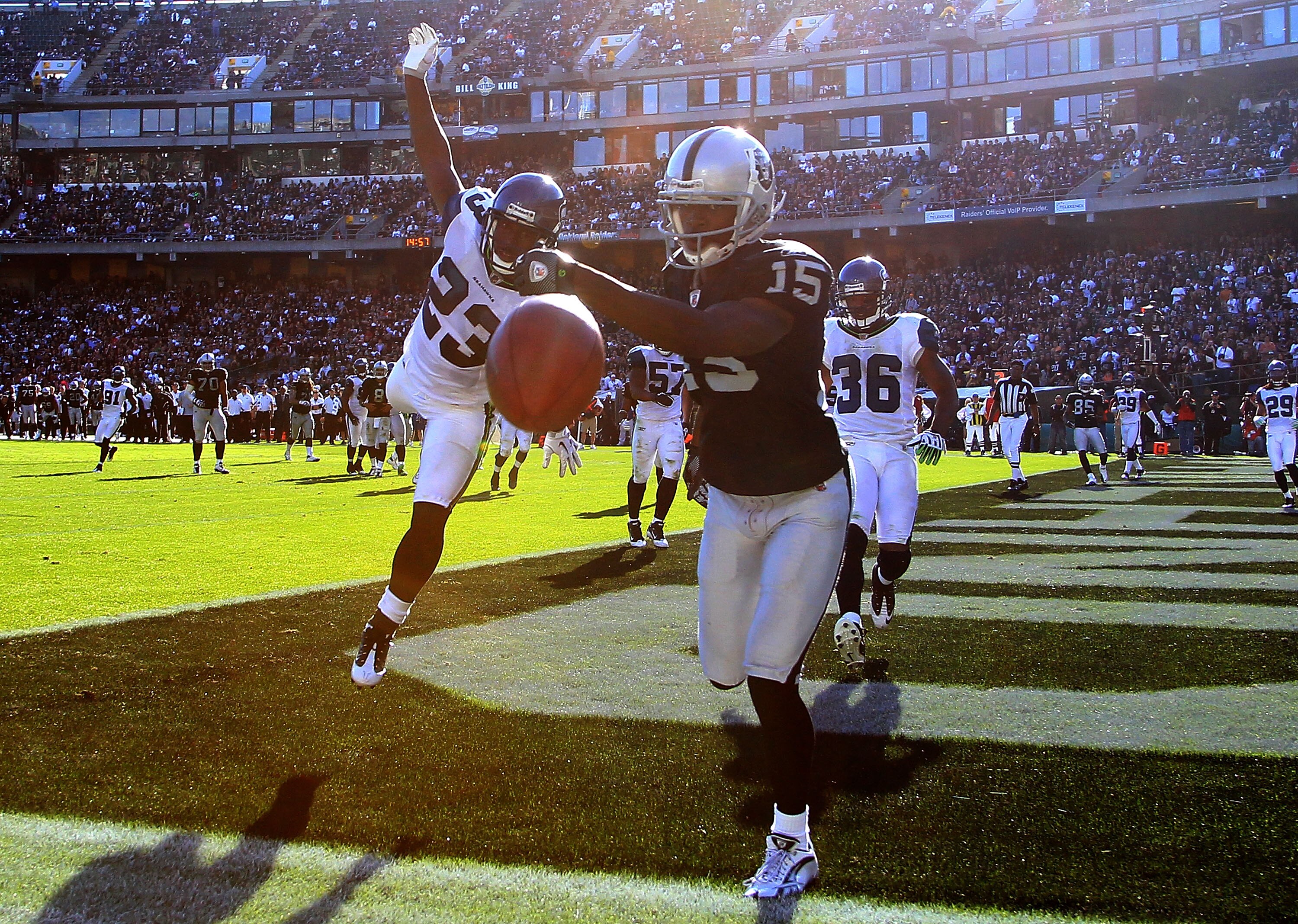 OAKLAND, CA - OCTOBER 31:  Marcus Trufant #23 of the Seattle Seahawks defends Johnnie Lee Higgins #15 of the Oakland Raiders at Oakland-Alameda County Coliseum on October 31, 2010 in Oakland, California.  (Photo by Ezra Shaw/Getty Images)