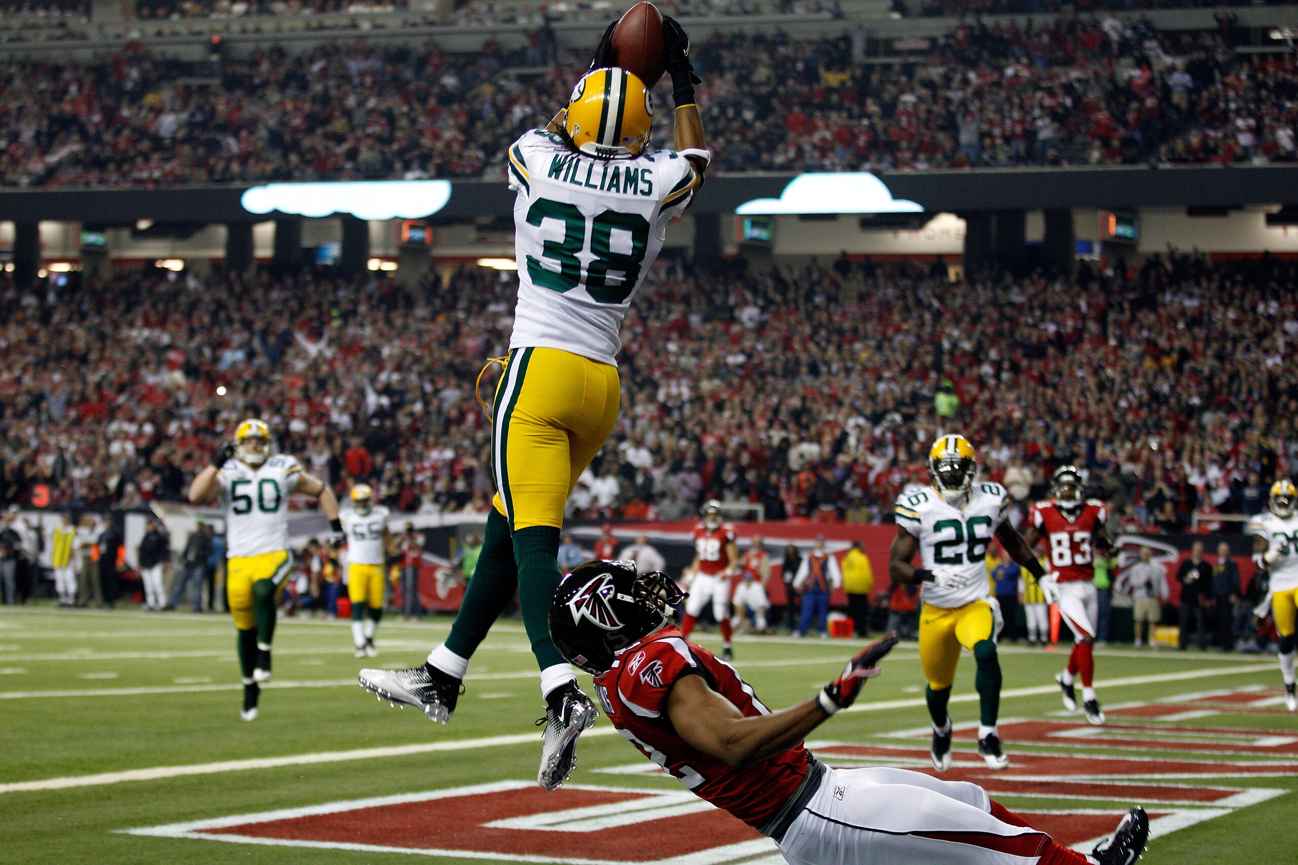 ATLANTA, GA - JANUARY 15: Tramon Williams #38 of the Green Bay Packers intercepts a pass in the endzone against Michael Jenkins #12 of the Atlanta Falcons during their 2011 NFC divisional playoff game at Georgia Dome on January 15, 2011 in Atlanta, Georg ATLANTA, GA - JANUARY 15: Tramon Williams #38 of the Green Bay Packers intercepts a pass in the endzone against Michael Jenkins #12 of the Atlanta Falcons during their 2011 NFC divisional playoff game at Georgia Dome on January 15, 2011 in Atlanta, Georg