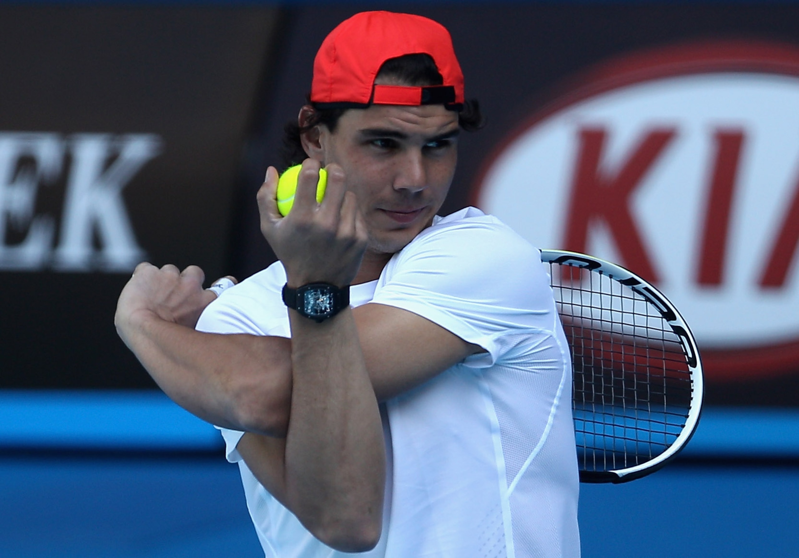 MELBOURNE, AUSTRALIA - JANUARY 16:  Rafael Nadal of Spain stretches during a practice session ahead of the 2011 Australian Open at Melbourne Park on January 16, 2011 in Melbourne, Australia.  (Photo by Mark Dadswell/Getty Images)