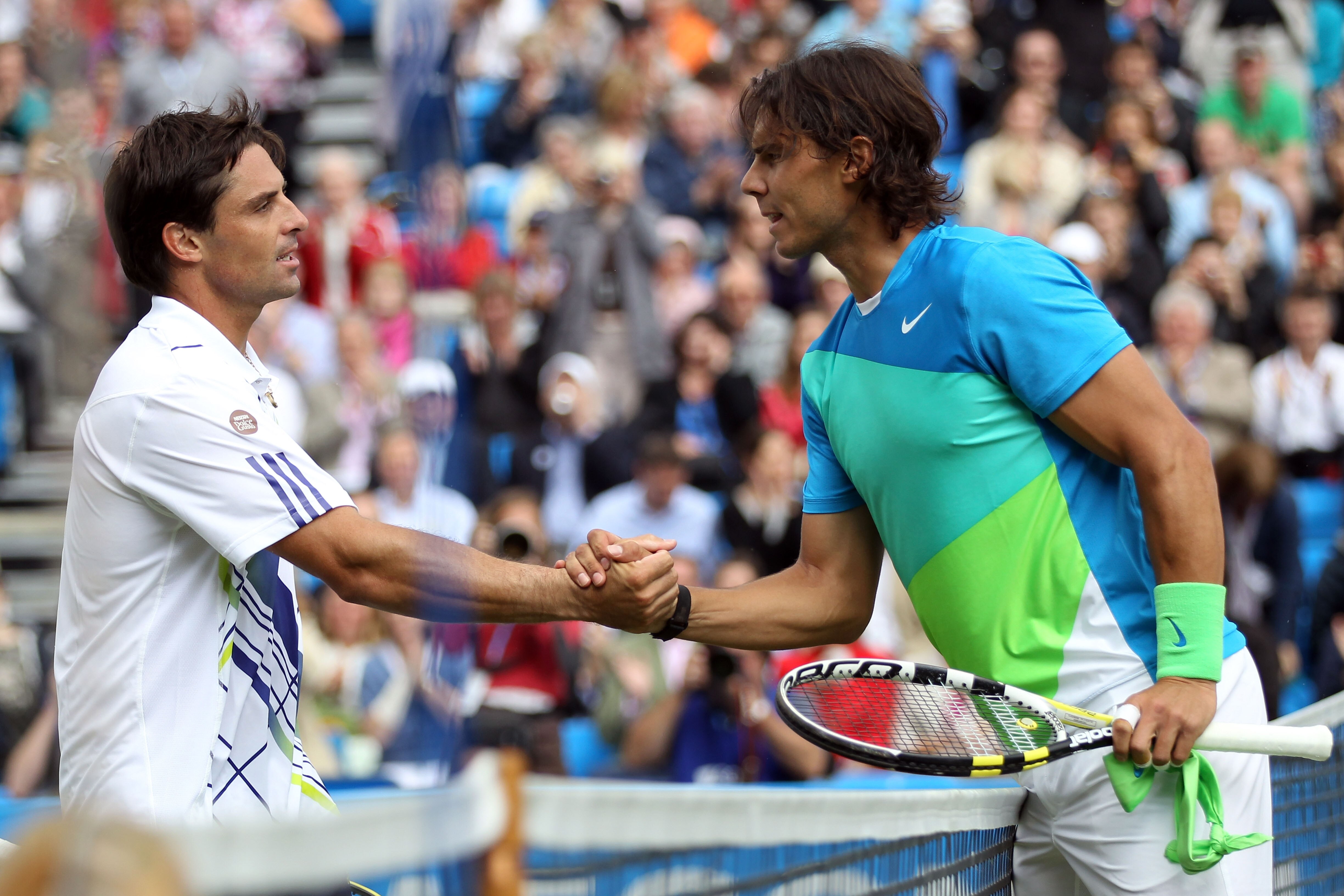 LONDON, ENGLAND - JUNE 09:  Rafael Nadal (R) of Spain shakes hands after victory in his second round match against Marcos Daniel of Brazilon Day 3 of the the AEGON Championships at Queen's Club on June 9, 2010 in London, England.  (Photo by Clive Brunskil