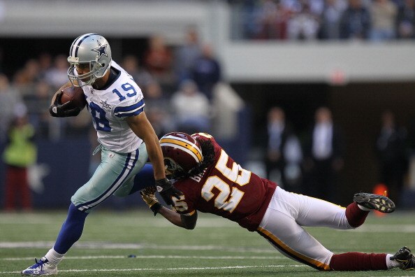 ARLINGTON, TX - DECEMBER 19:  Wide receiver Miles Austin #19 of the Dallas Cowboys runs the ball against Kevin Barnes #25 of the Washington Redskins at Cowboys Stadium on December 19, 2010 in Arlington, Texas.  (Photo by Ronald Martinez/Getty Images)