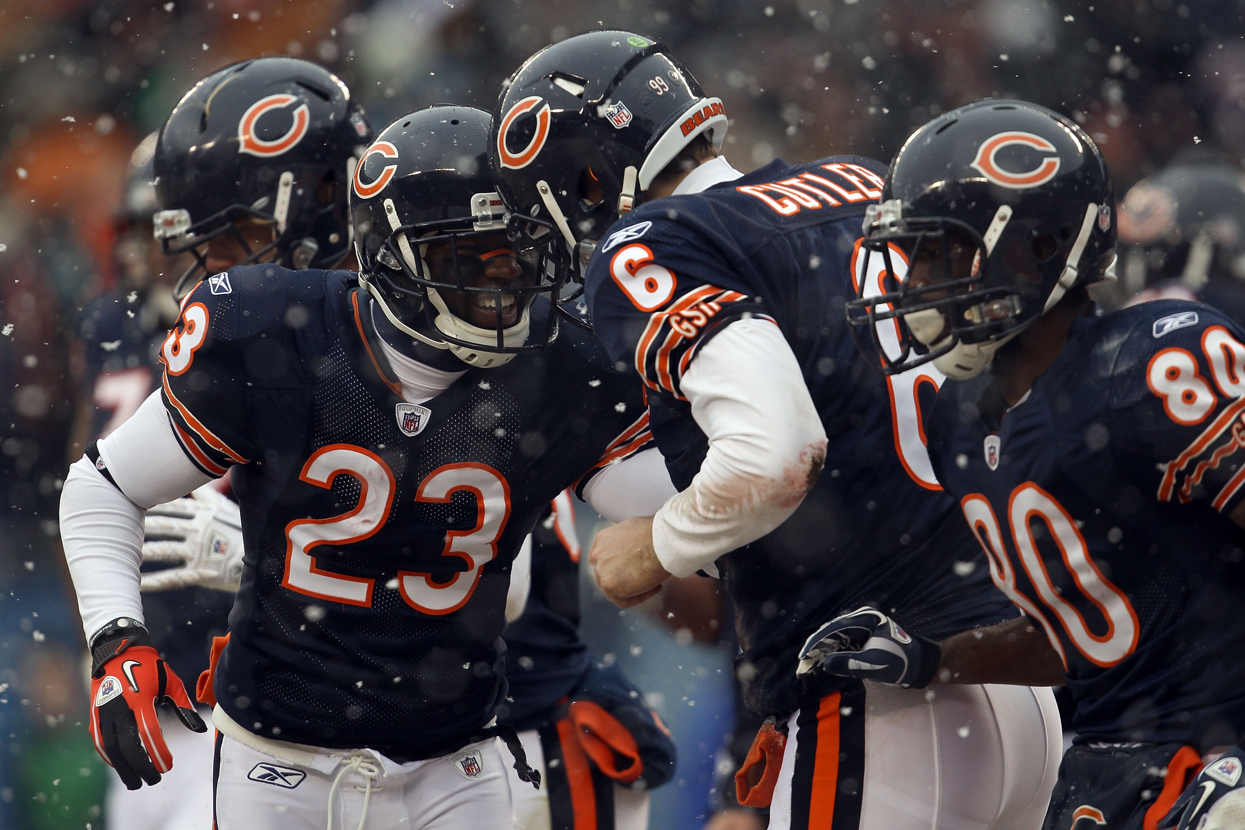 CHICAGO, IL - JANUARY 16:  Quarterback Jay Cutler #6 of the Chicago Bears celebrates his six-yard touchdown run with Devin Hester #23 against the Seattle Seahawks in the second quarter of the 2011 NFC divisional playoff game at Soldier Field on January 16