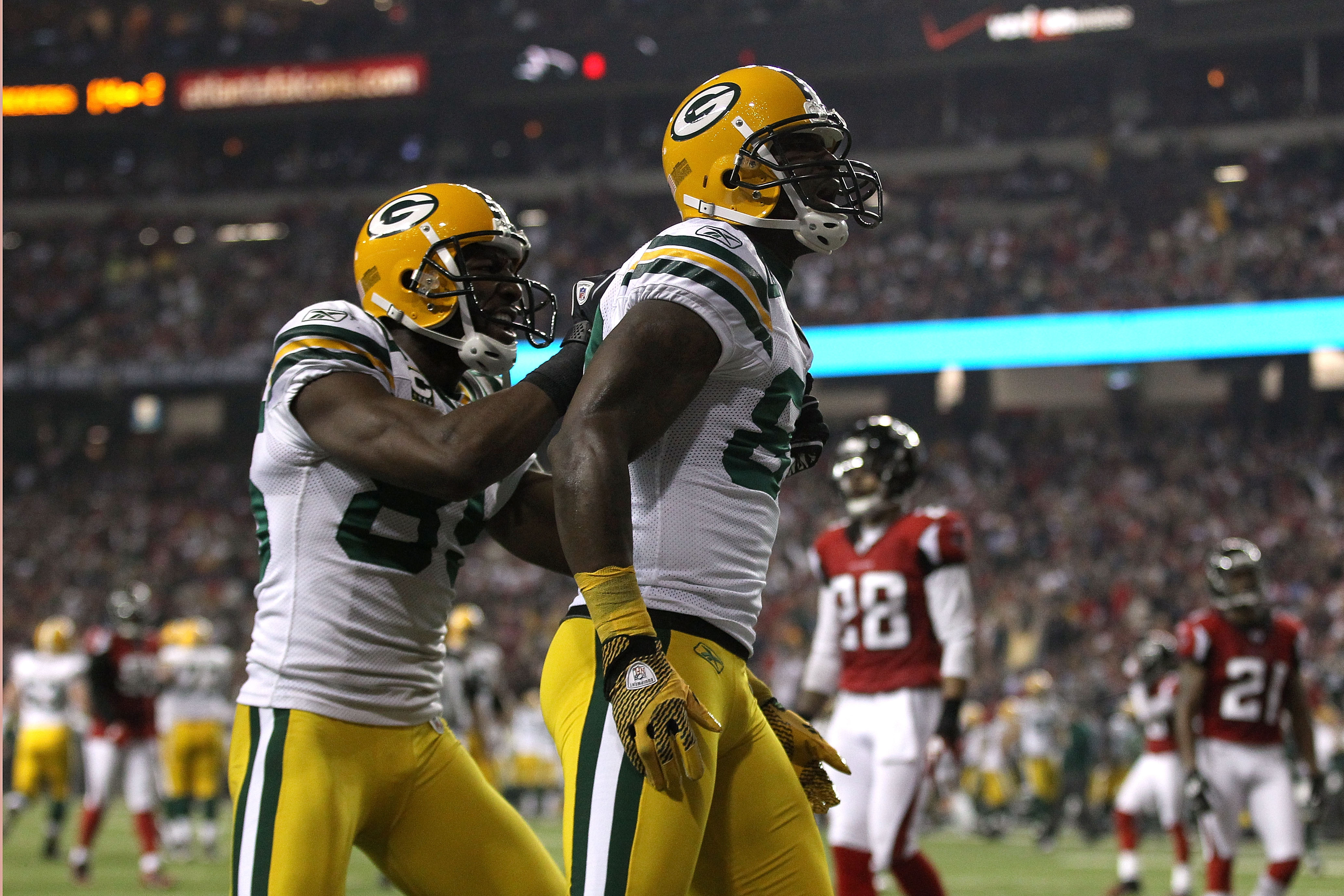 ATLANTA, GA - JANUARY 15:  James Jones #89 (R) and Greg Jennings #85 of the Green Bay Packers celebrate after Jones scored a 20-yard touchdown in the second quarter against the Atlanta Falcons during their 2011 NFC divisional playoff game at Georgia Dome
