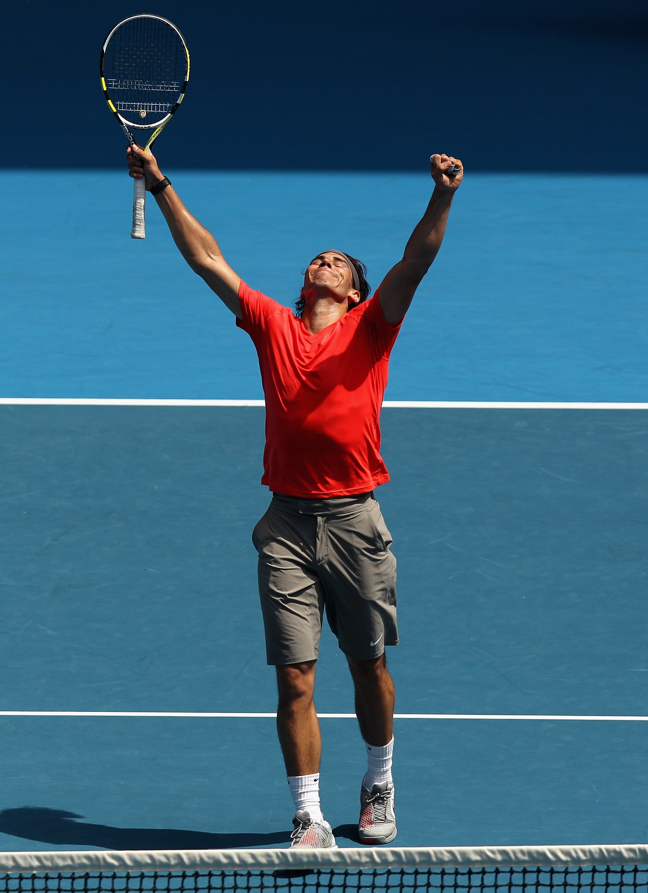 MELBOURNE, AUSTRALIA - JANUARY 16:  Rafael Nadal of Spaincelebrates a point during the 'Rally For Relief' charity exhibition match ahead of the 2011 Australian Open at Melbourne Park on January 16, 2011 in Melbourne, Australia.  (Photo by Mark Dadswell/Ge
