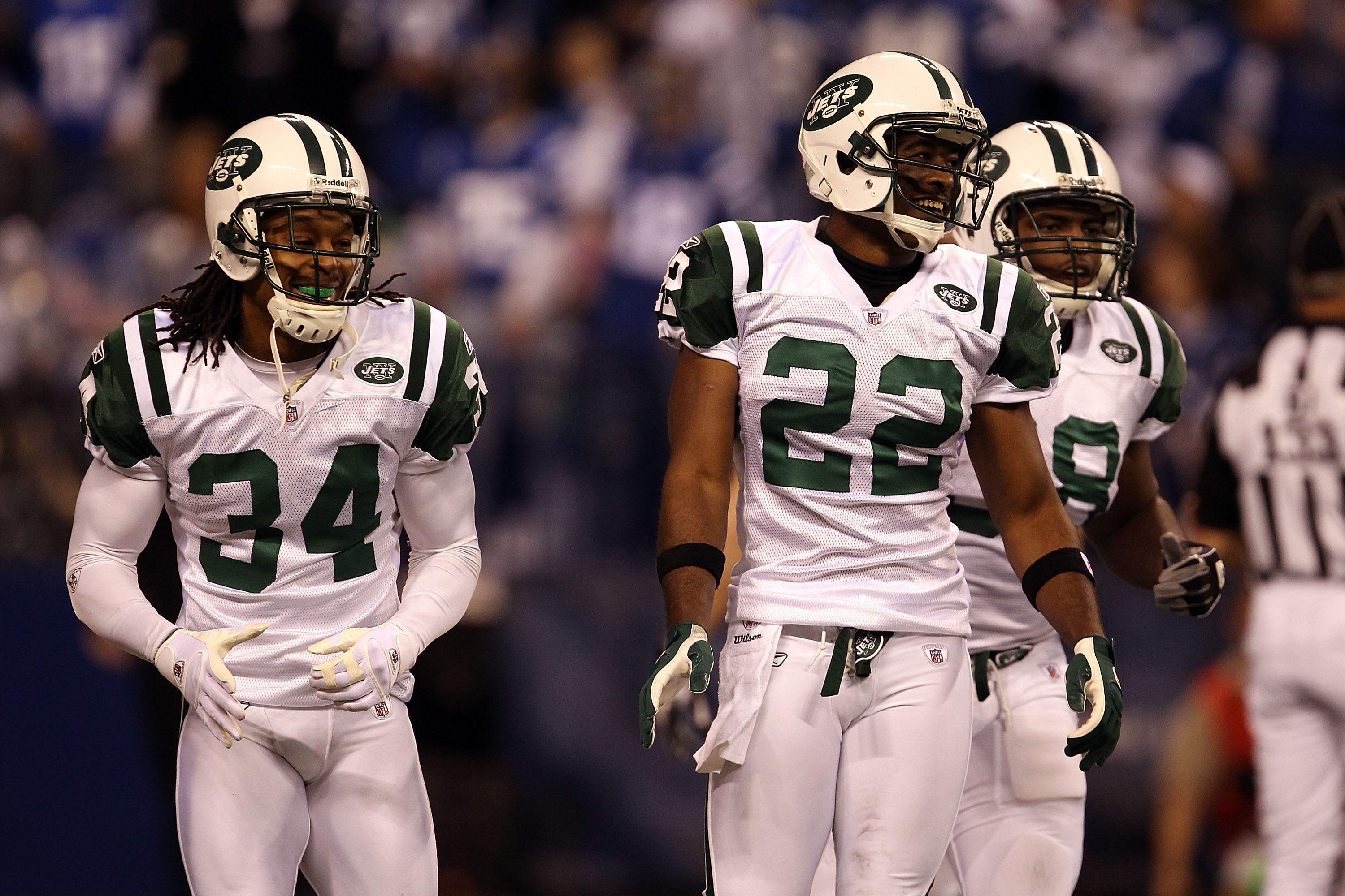 INDIANAPOLIS, IN - JANUARY 08:  Brodney Pool #22 and Marquice Cole #34 (L) of the New York Jets react after a defensive play aganst the Indianapolis Colts during their 2011 AFC wild card playoff game at Lucas Oil Stadium on January 8, 2011 in Indianapolis
