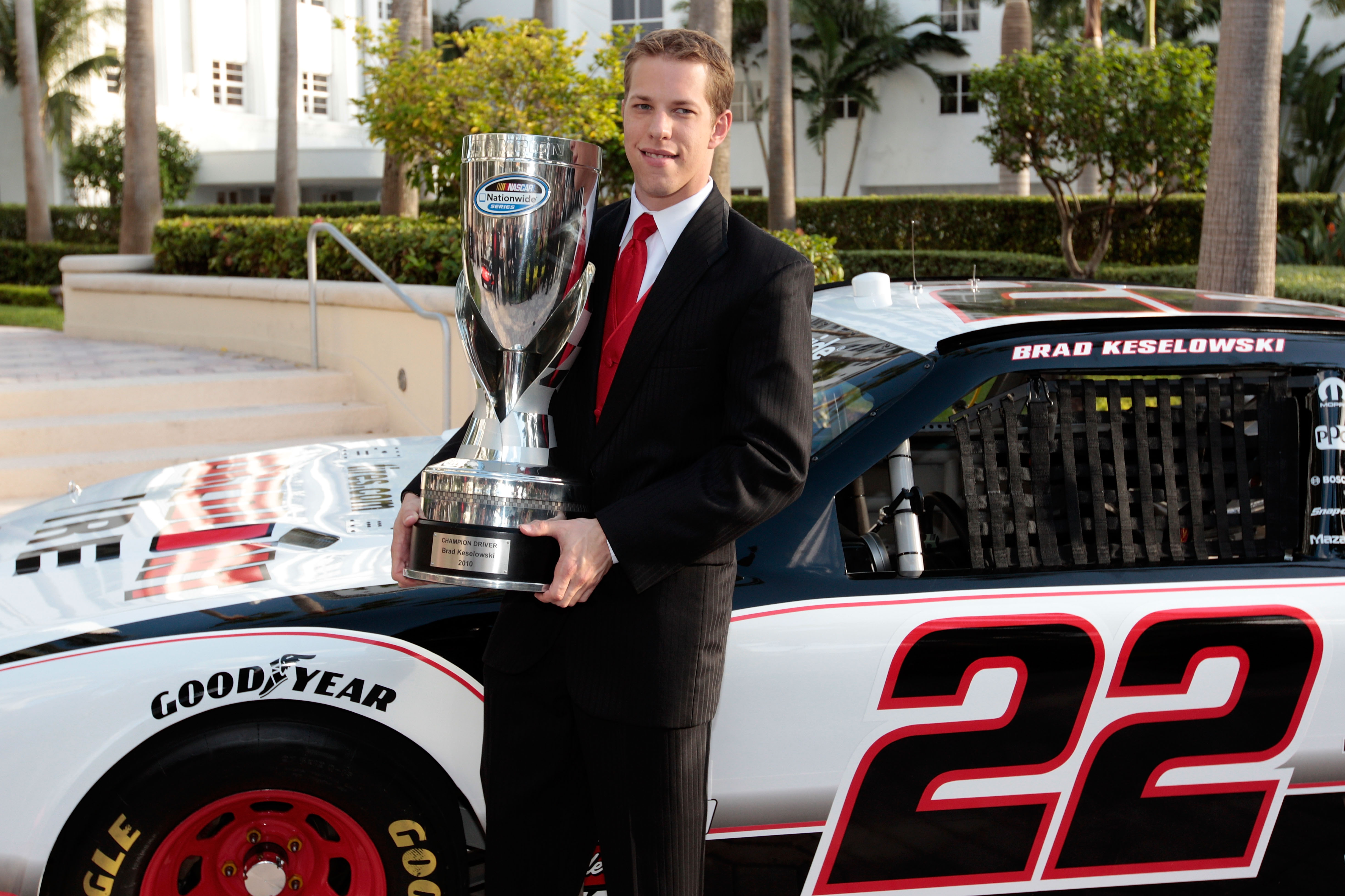 MIAMI - NOVEMBER 22:  2010 Nationwide Series Champion Brad Keselowski, driver of the #22 Discount Tire Dodge, poses with the Champions trophy during the NASCAR Nationwide/Camping World Truck Series Banquet at Loews Miami Beach Hotel on November 22, 2010 i