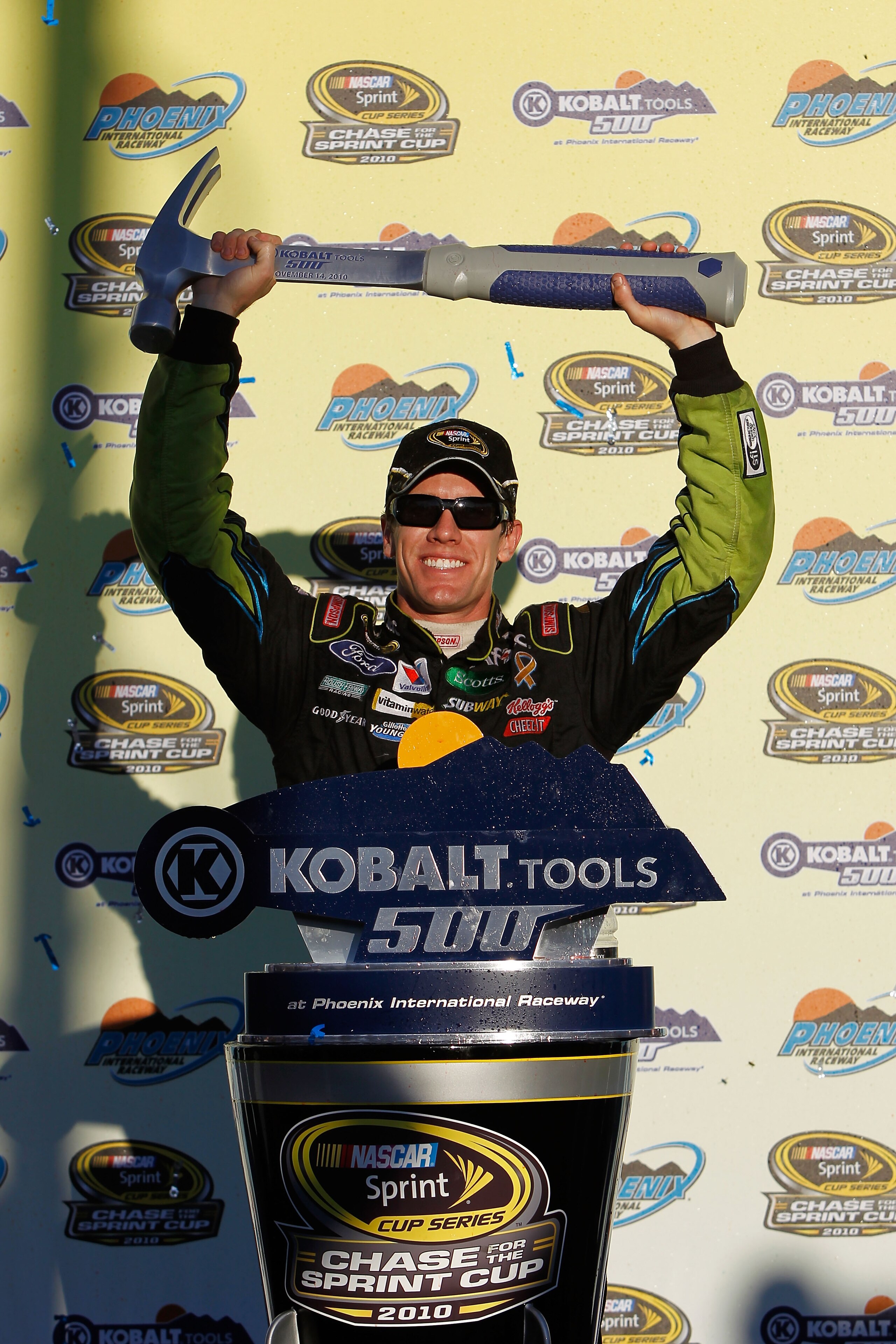 AVONDALE, AZ - NOVEMBER 14:  Carl Edwards, driver of the #99 Aflac Ford, celebrates in victory lane after winning the NASCAR Sprint Cup Series Kobalt Tools 500 at Phoenix International Raceway on November 14, 2010 in Avondale, Arizona.  (Photo by Chris Tr