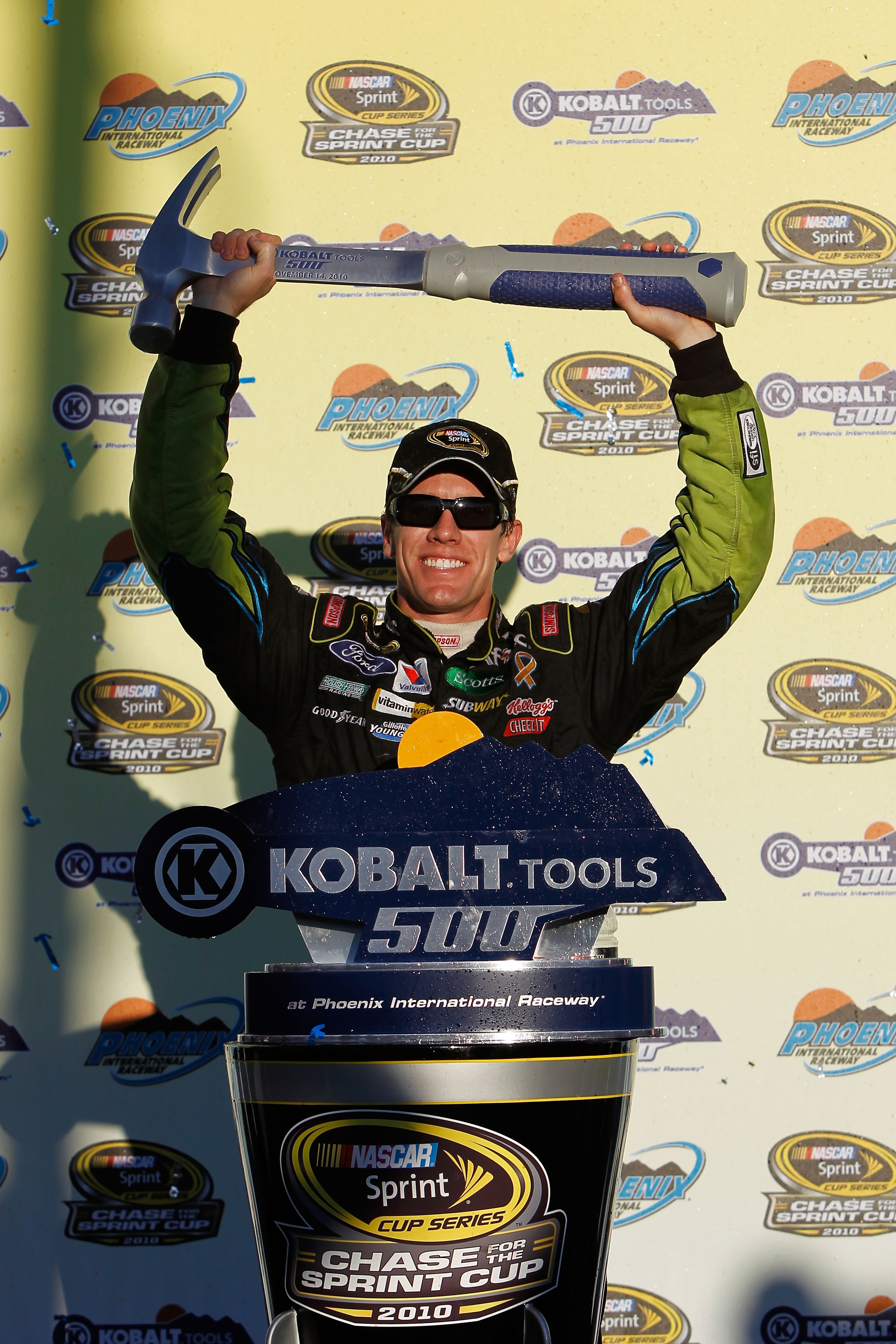 AVONDALE, AZ - NOVEMBER 14:  Carl Edwards, driver of the #99 Aflac Ford, celebrates in victory lane after winning the NASCAR Sprint Cup Series Kobalt Tools 500 at Phoenix International Raceway on November 14, 2010 in Avondale, Arizona.  (Photo by Chris Tr