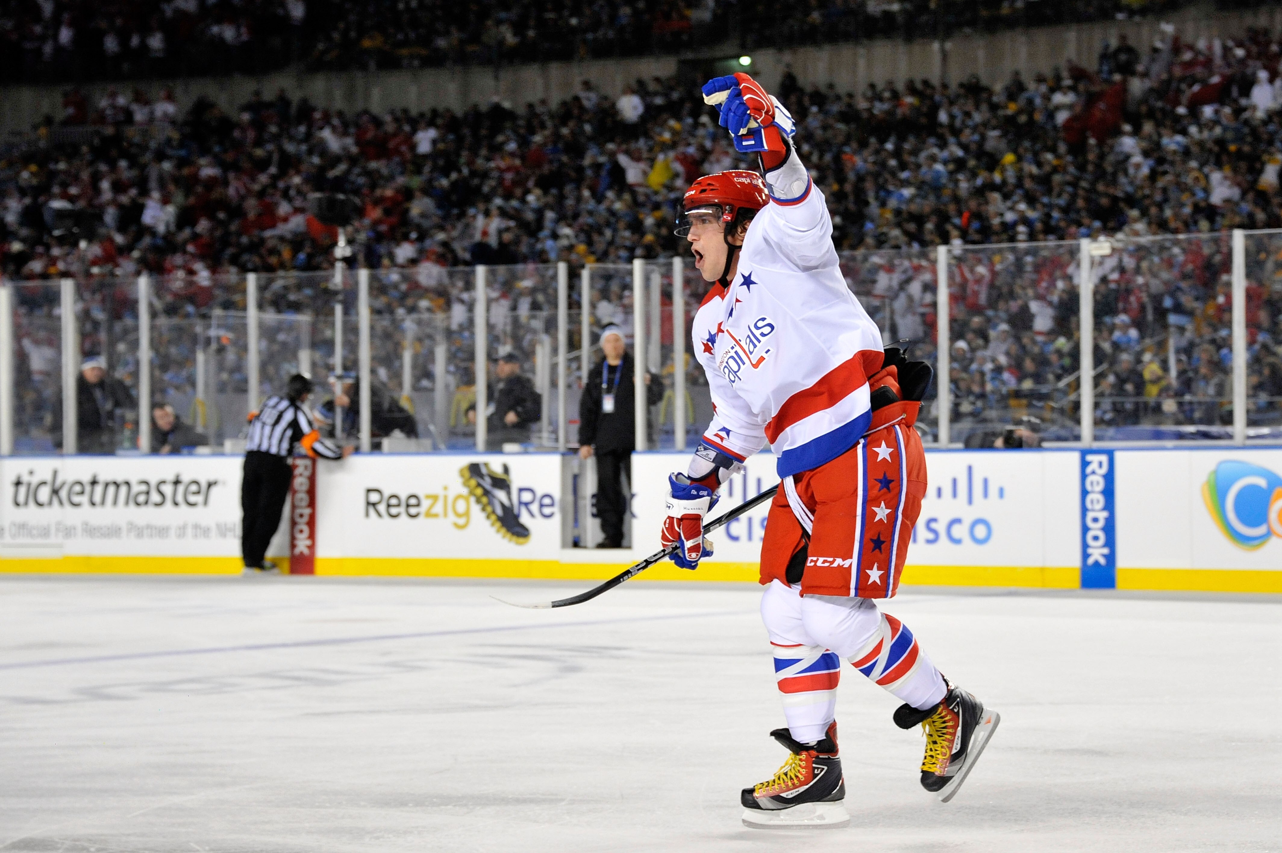 PITTSBURGH, PA - JANUARY 01:  Captain Alex Ovechkin #8 of the Washington Capitals celebrates a goal by teammate Mike Knuble #22 (not pictured) during the second period of the game against the Pittsburgh Penguins at the 2011 NHL Bridgestone Winter Classic